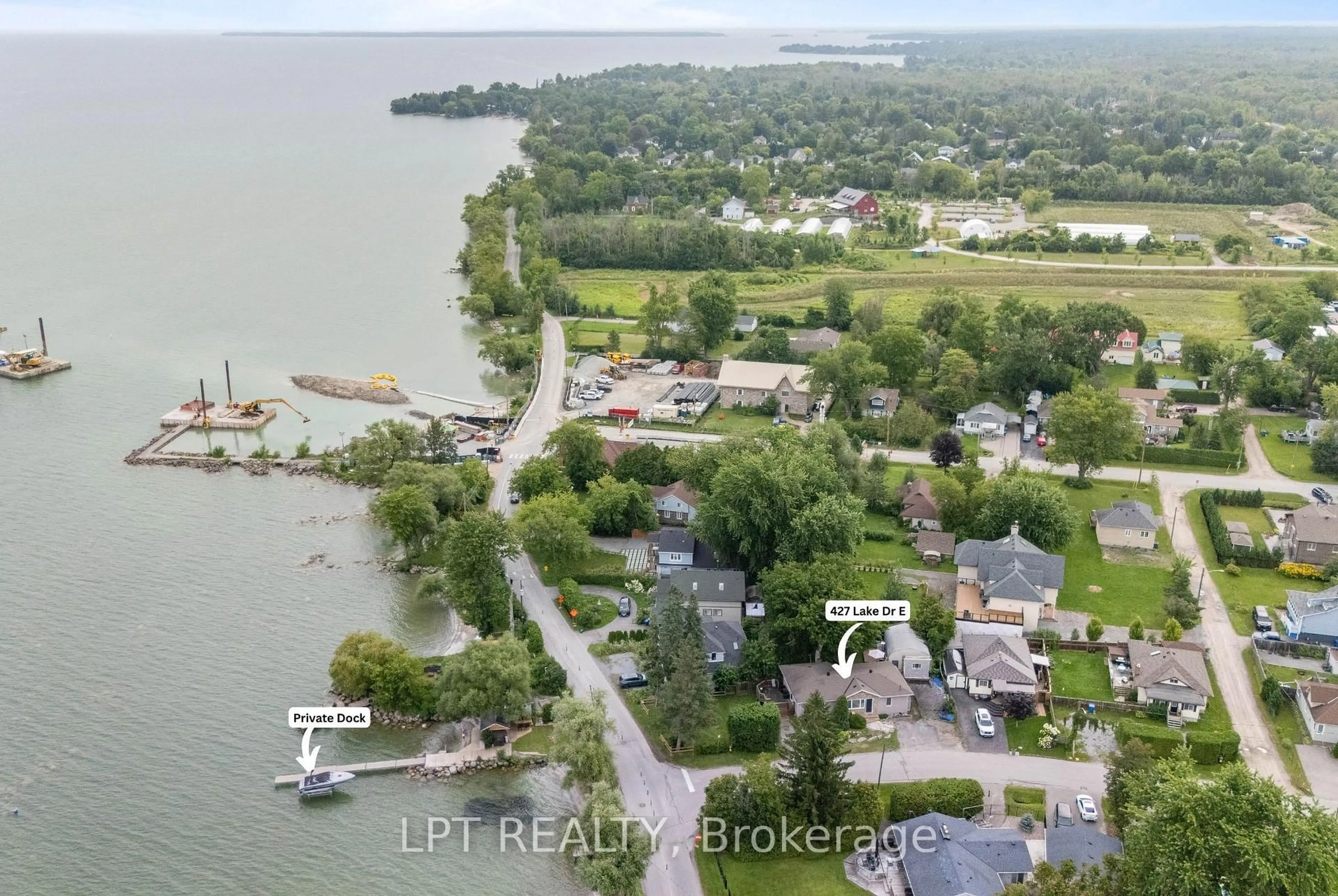 A pic from outside/outdoor area/front of a property/back of a property/a pic from drone, water/lake/river/ocean view for 427 Lake Dr, Georgina Ontario L0E 1S0