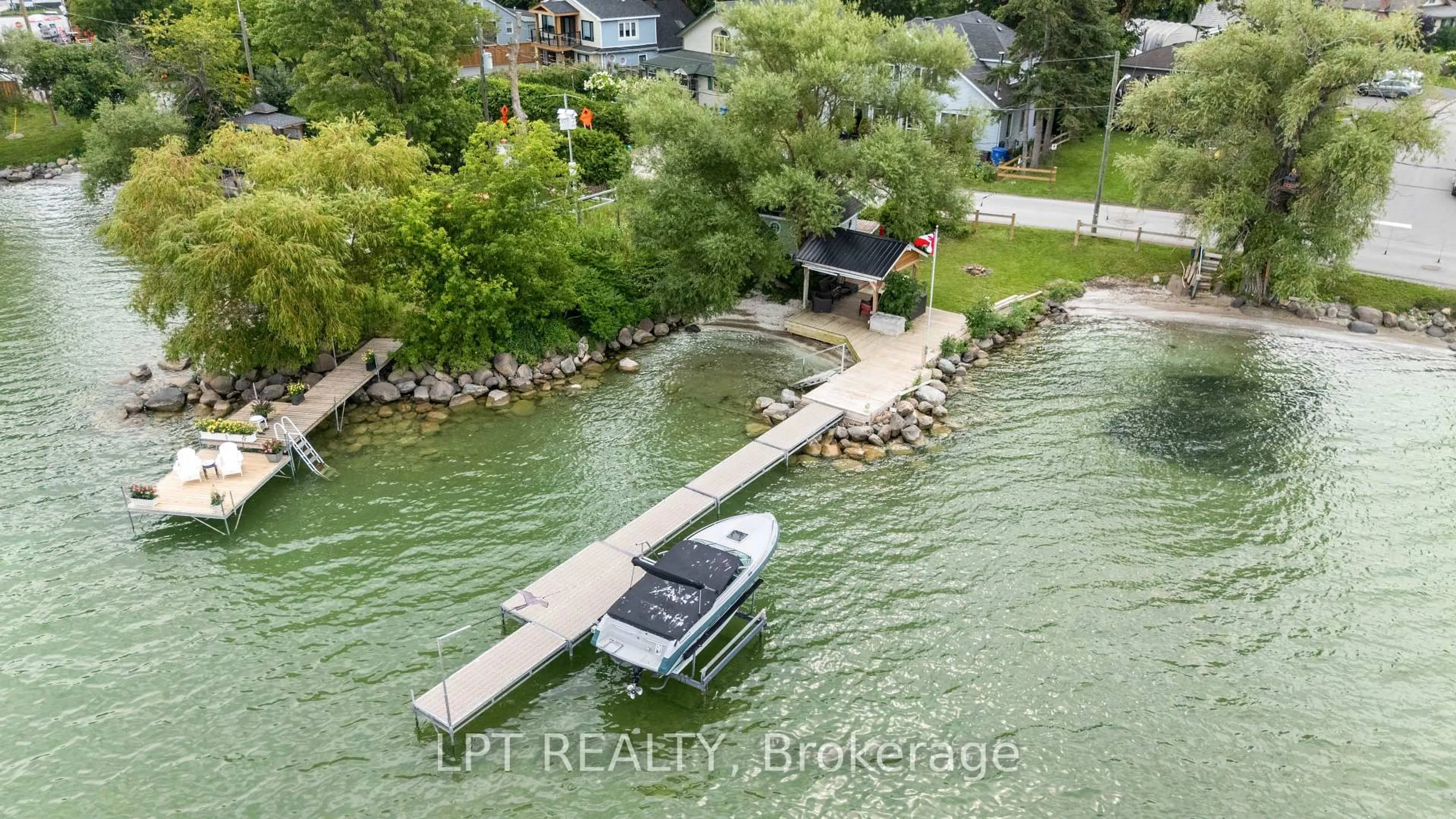 A pic from outside/outdoor area/front of a property/back of a property/a pic from drone, water/lake/river/ocean view for 427 Lake Dr, Georgina Ontario L0E 1S0