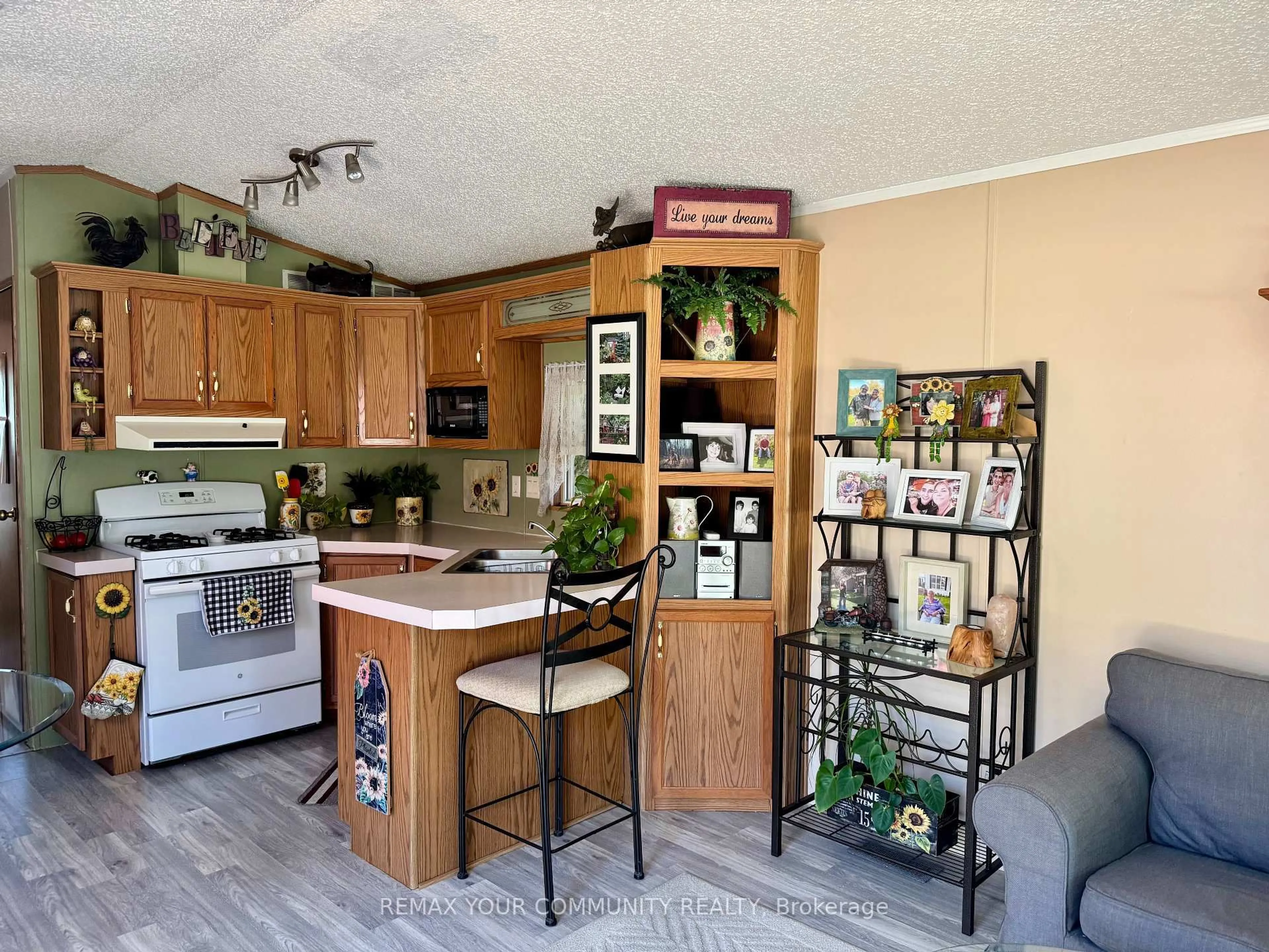 Open concept kitchen, wood/laminate floor for 285 Crydermans Sdrd #324, Georgina Ontario L0E 1A0