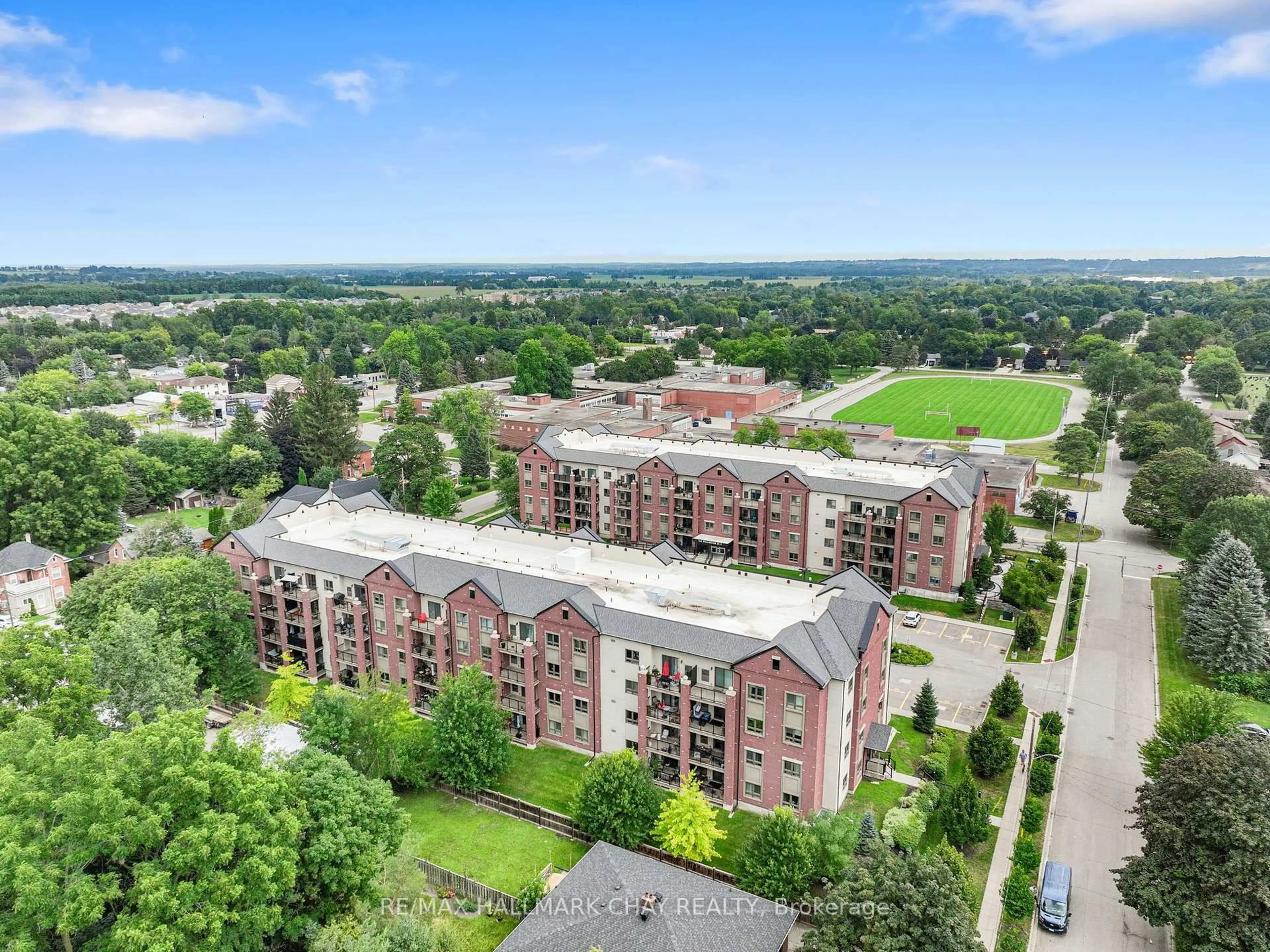 A pic from outside/outdoor area/front of a property/back of a property/a pic from drone, city buildings view from balcony for 157 WELLINGTON St #404, New Tecumseth Ontario L9R 0R7
