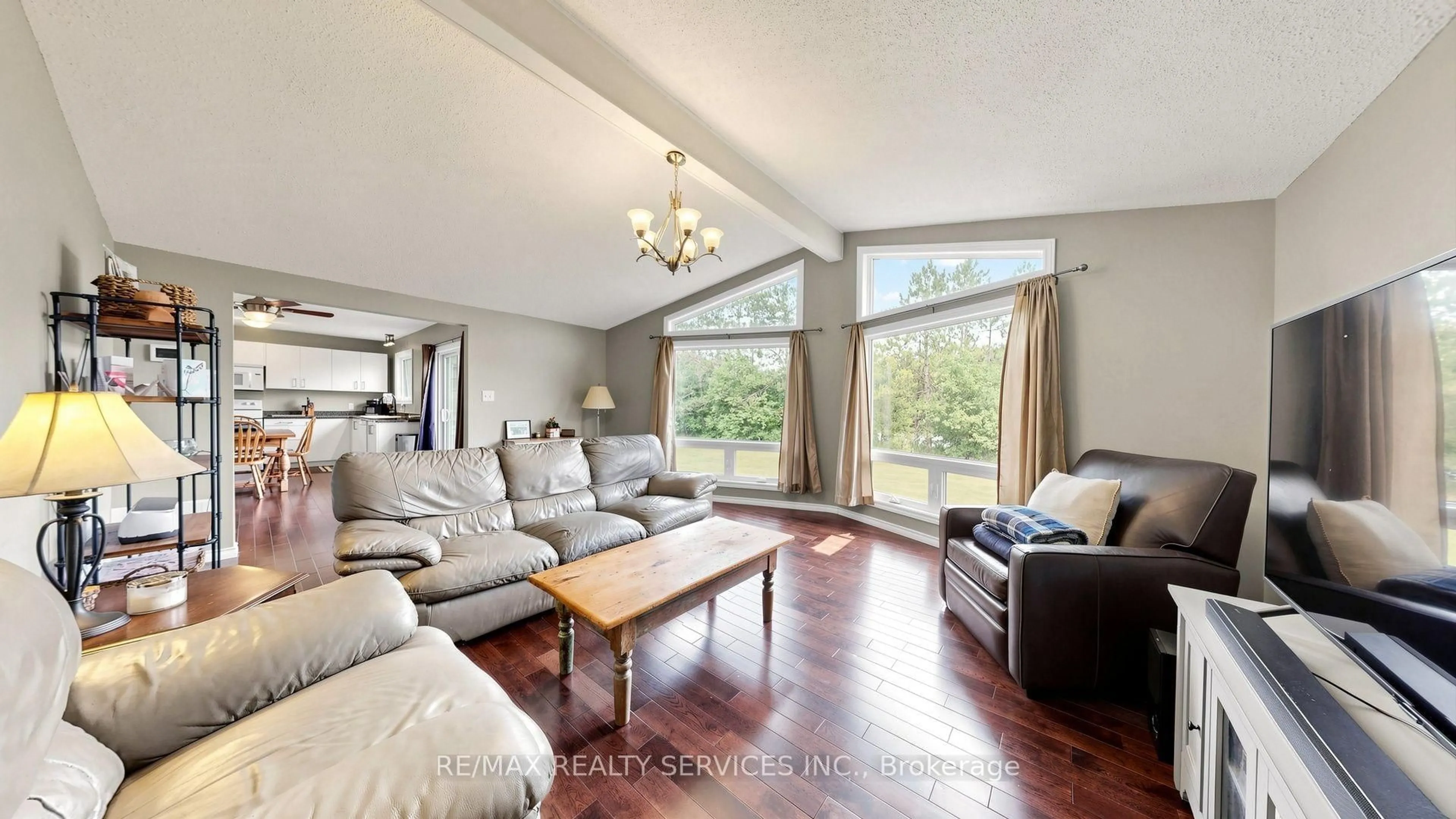 Living room with furniture, wood/laminate floor for 9225 County 1 Rd, Adjala-Tosorontio Ontario L0N 1P0