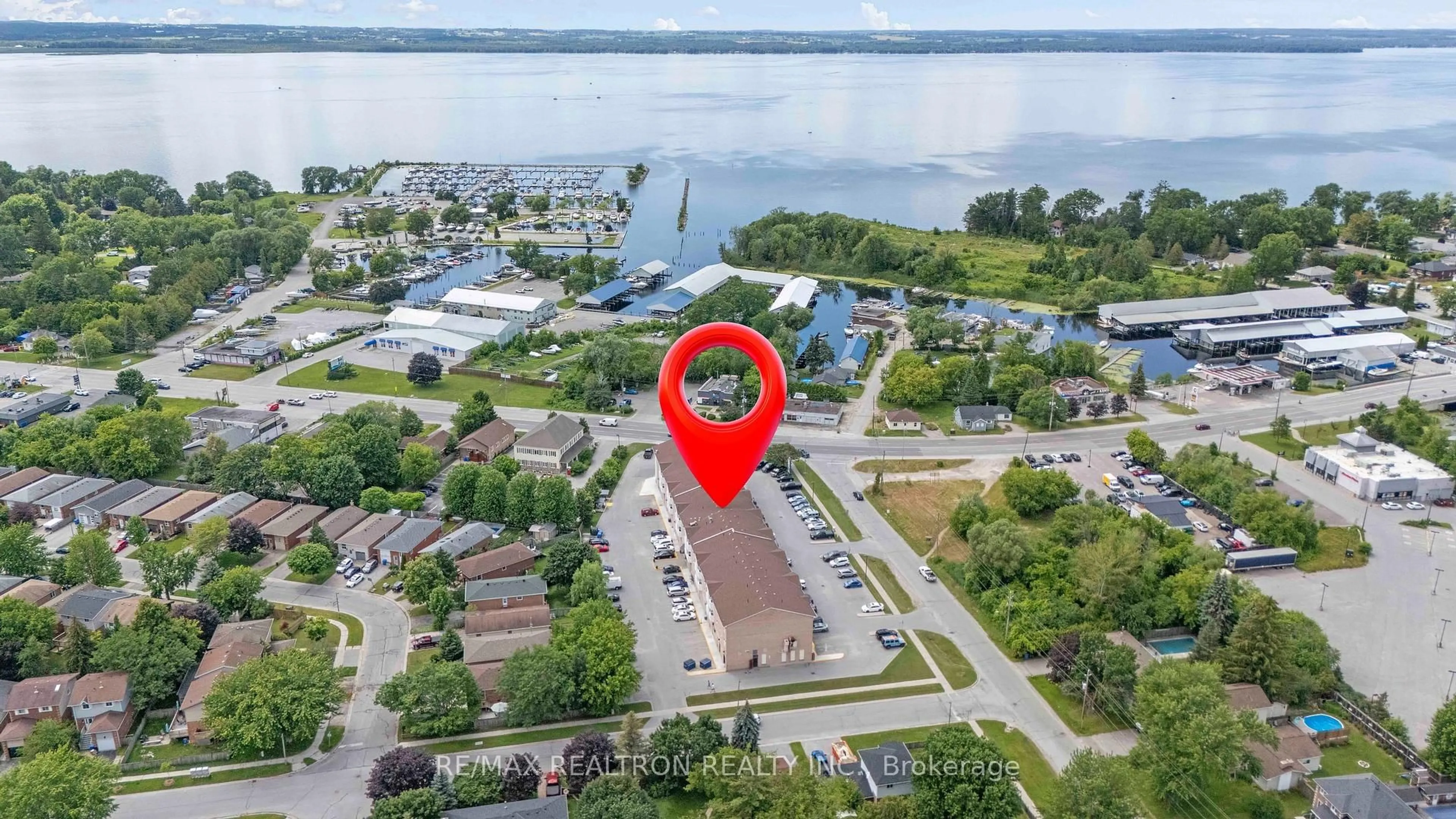 A pic from outside/outdoor area/front of a property/back of a property/a pic from drone, water/lake/river/ocean view for 155 Riverglen Dr #320, Georgina Ontario L4P 3M3
