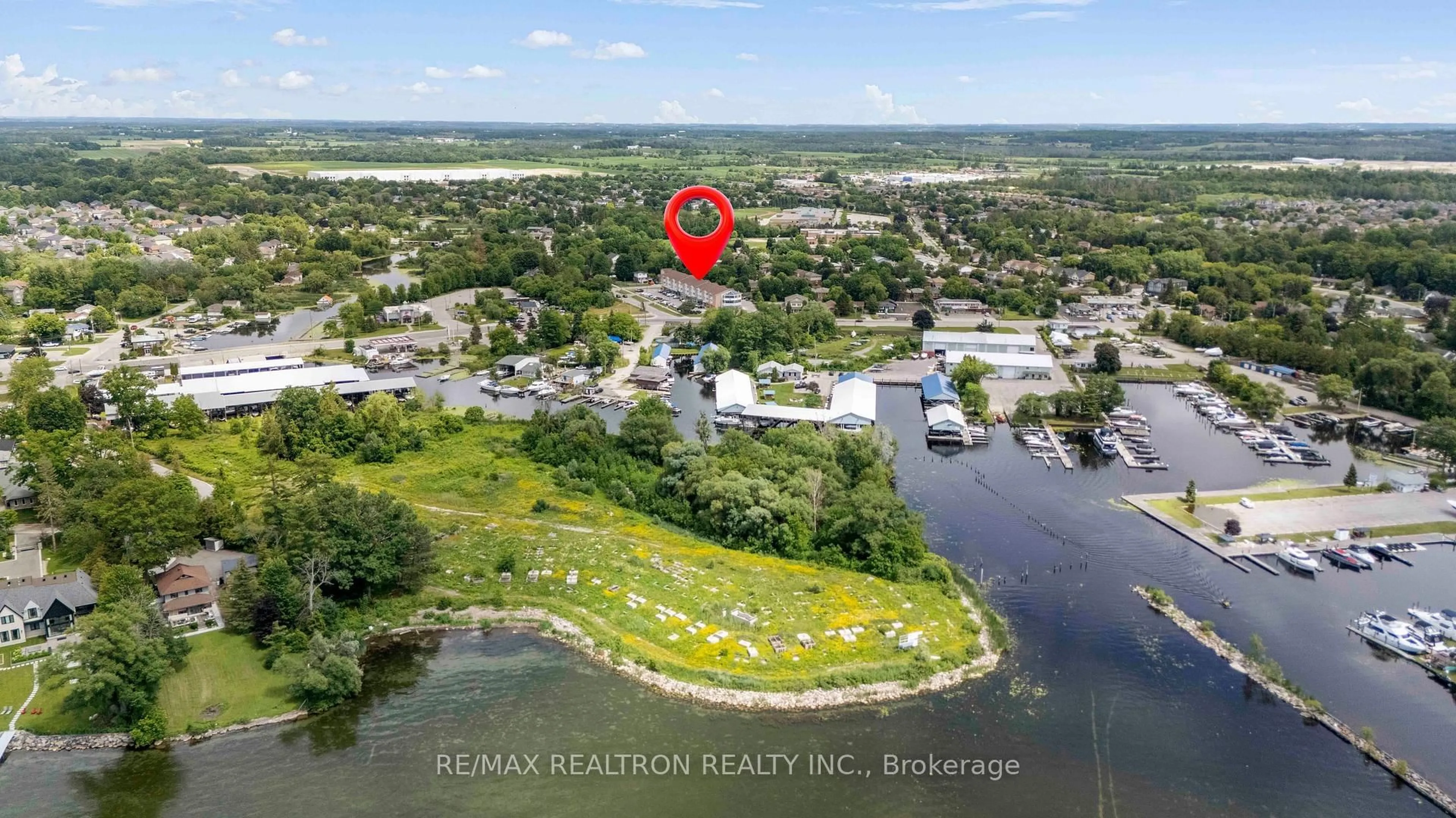 A pic from outside/outdoor area/front of a property/back of a property/a pic from drone, water/lake/river/ocean view for 155 Riverglen Dr #320, Georgina Ontario L4P 3M3