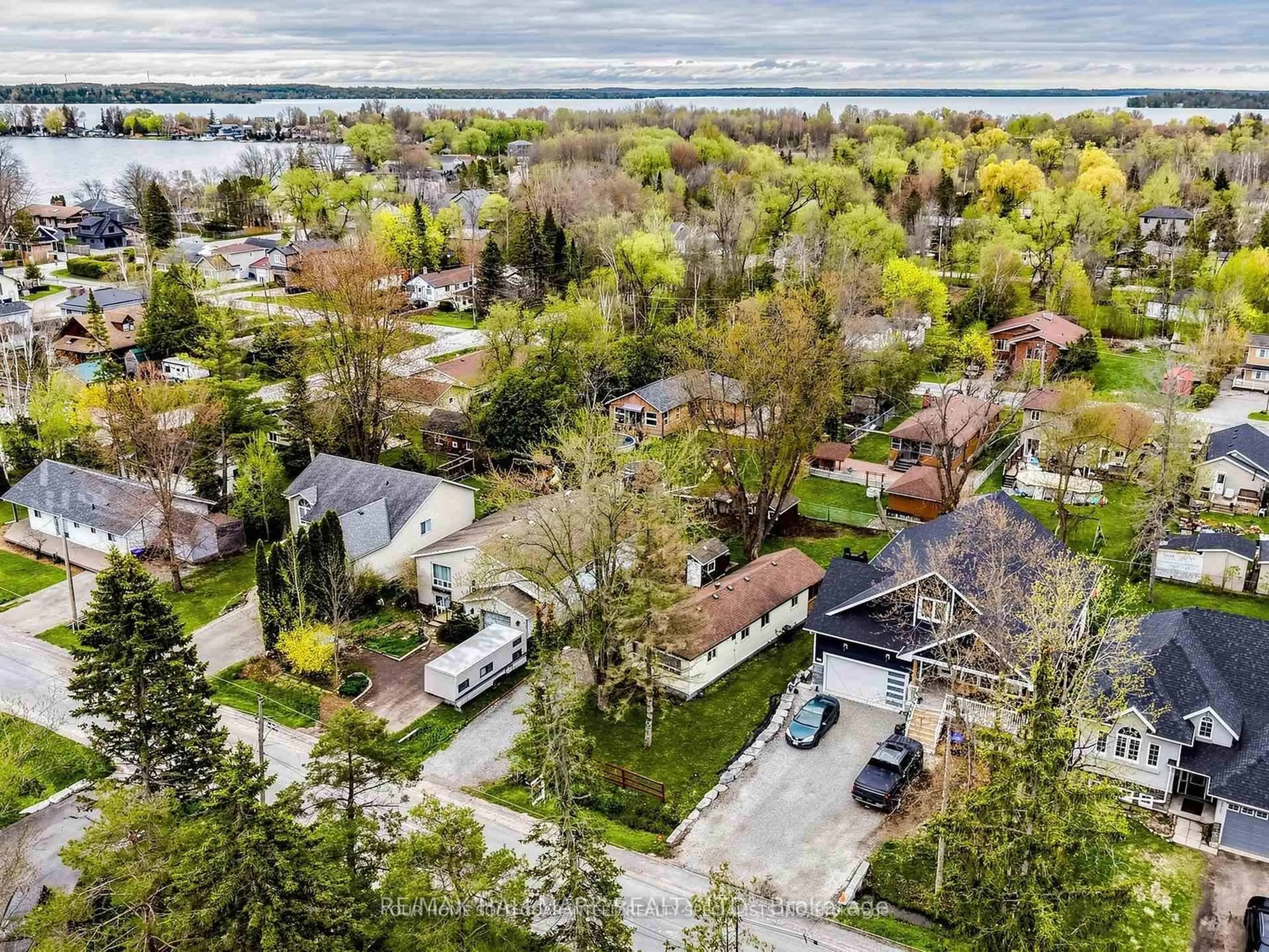 A pic from outside/outdoor area/front of a property/back of a property/a pic from drone, unknown for 1053 Elm Rd, Innisfil Ontario L0L 1C0