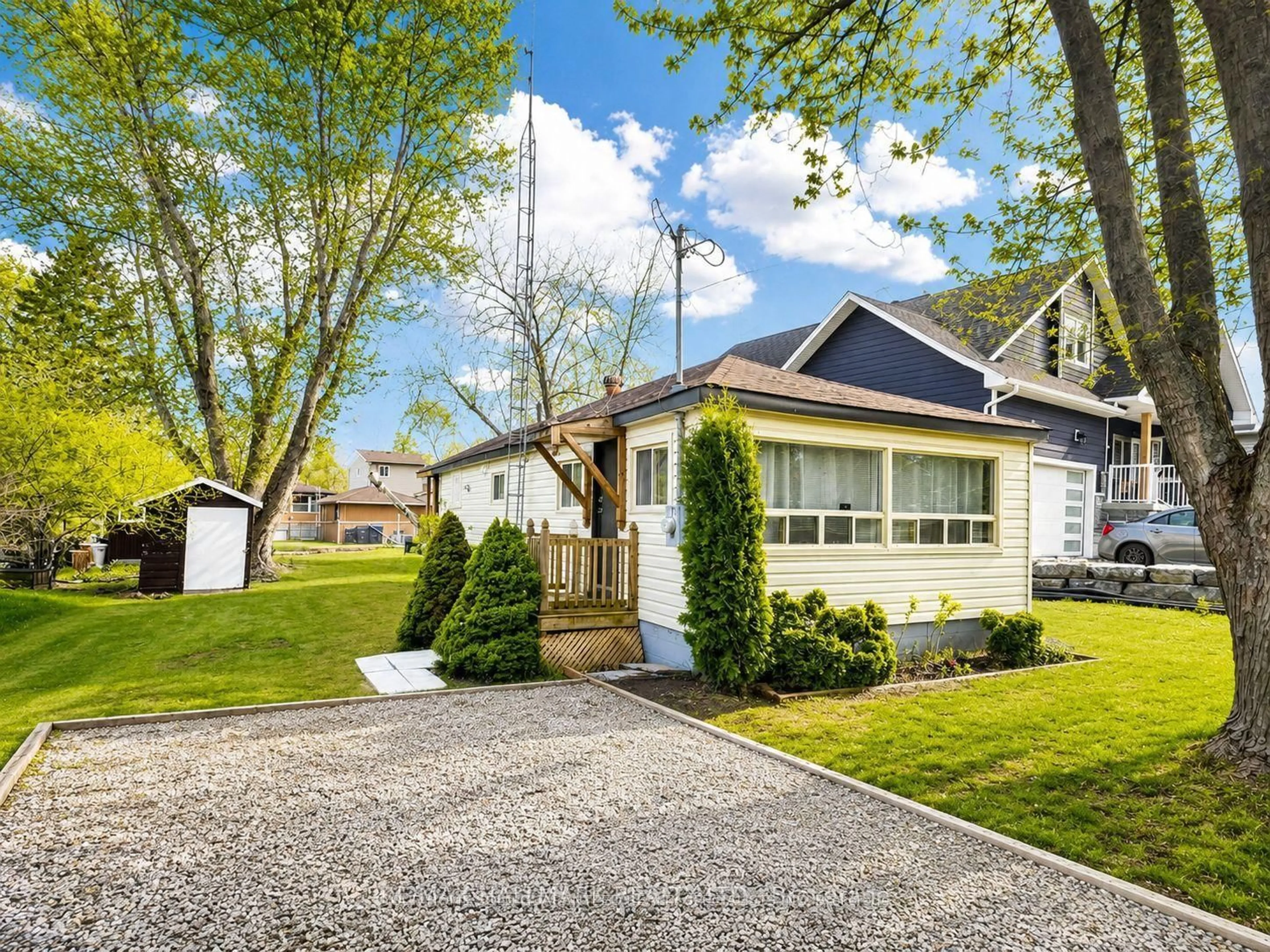 Home with vinyl exterior material, street for 1053 Elm Rd, Innisfil Ontario L0L 1C0