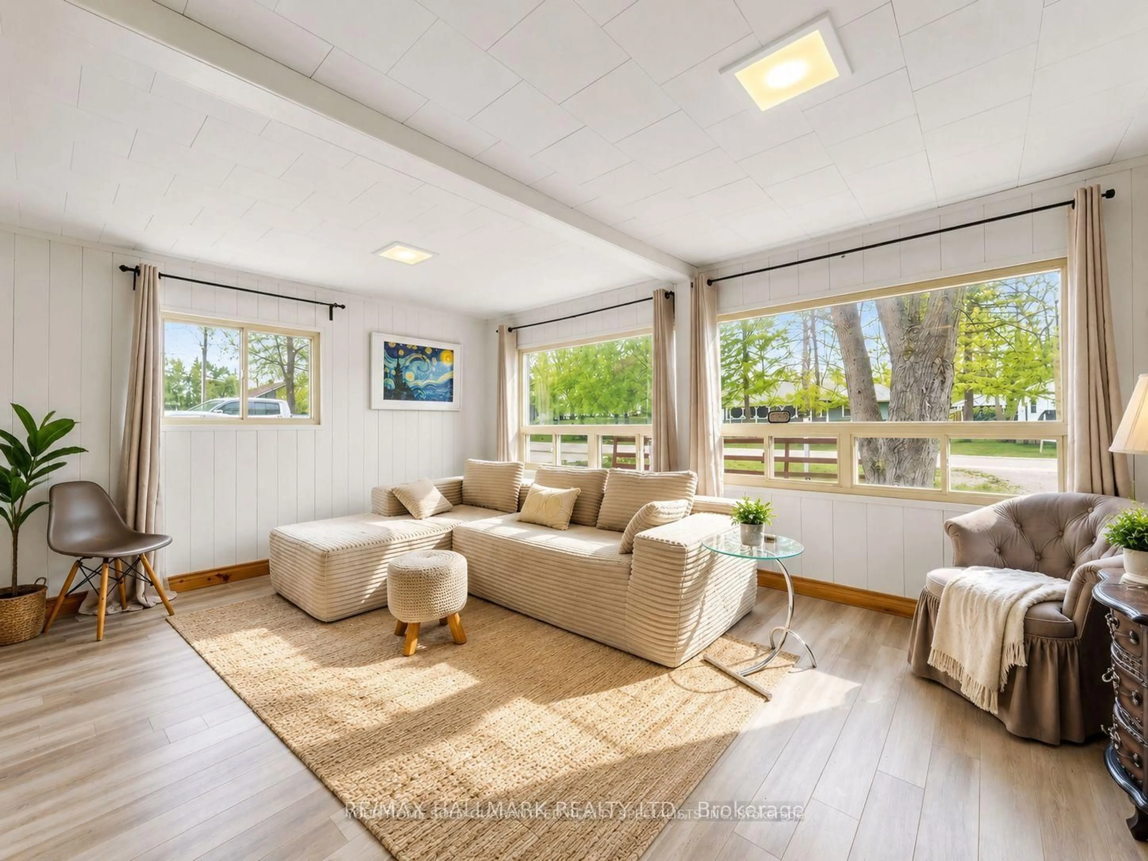 Living room with furniture, wood/laminate floor for 1053 Elm Rd, Innisfil Ontario L0L 1C0