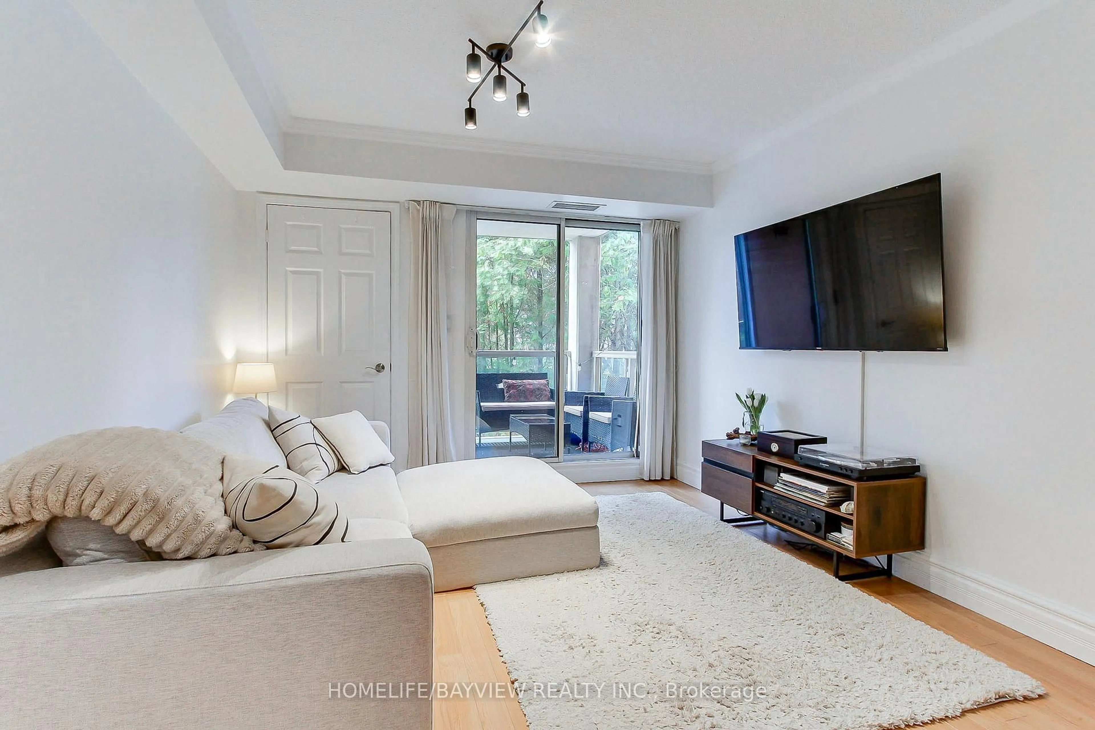 Living room with furniture, unknown for 245 Pine Grove Rd #110, Vaughan Ontario L4L 2H7