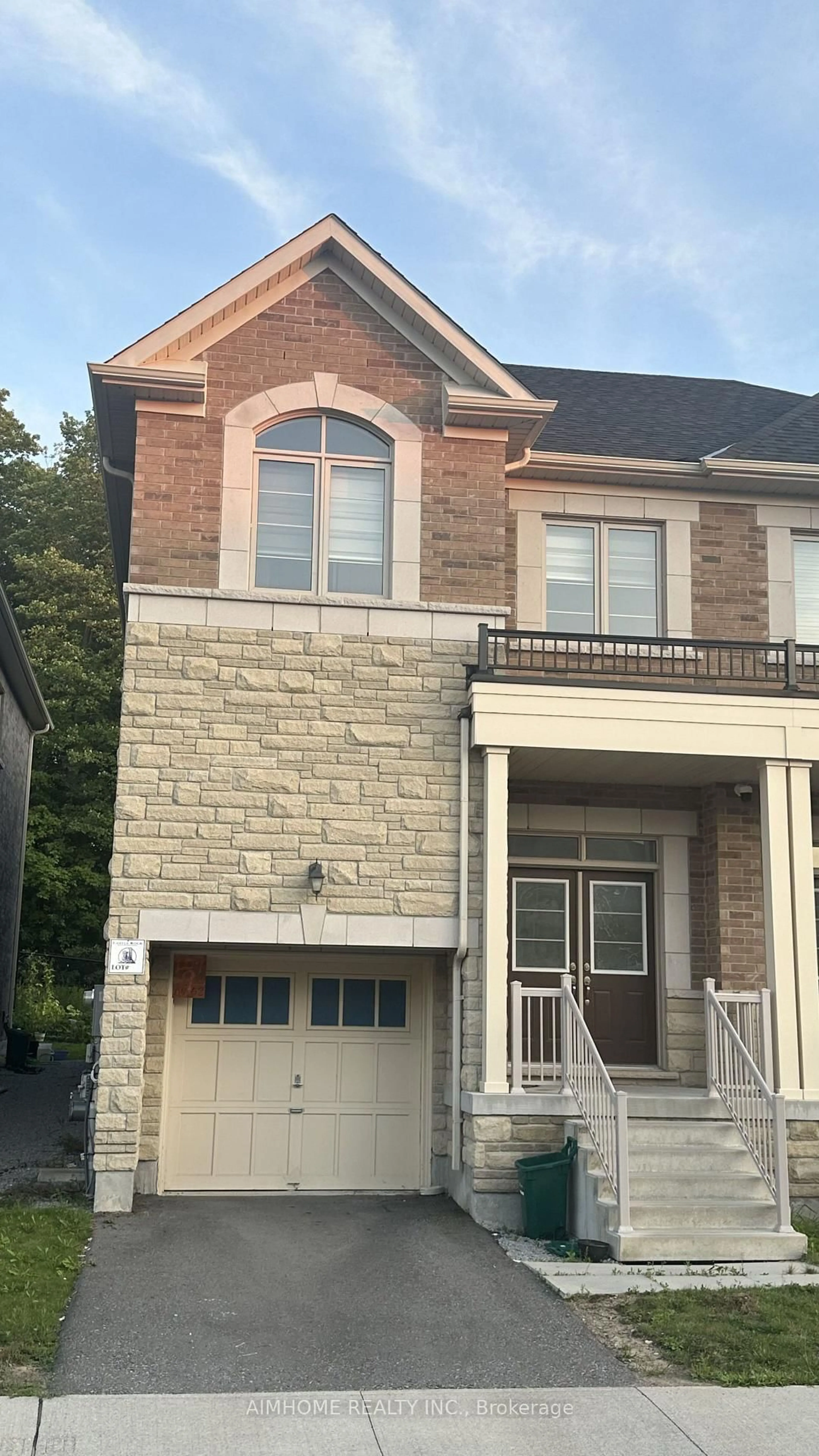 Home with brick exterior material, street for 52 Liam Lane, Markham Ontario L3S 0E8