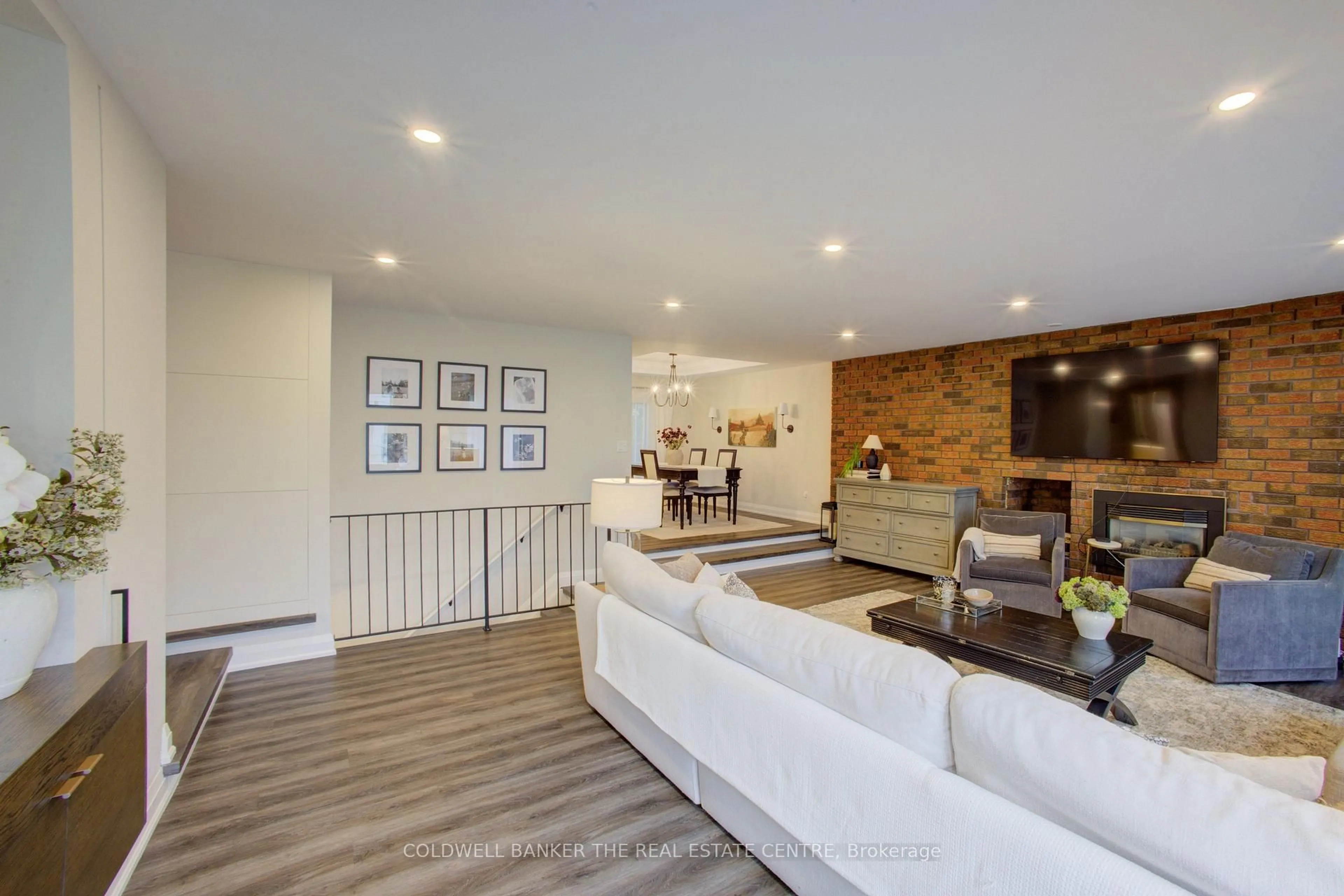 Living room with furniture, wood/laminate floor for 89 King St, Essa Ontario L0M 1B0
