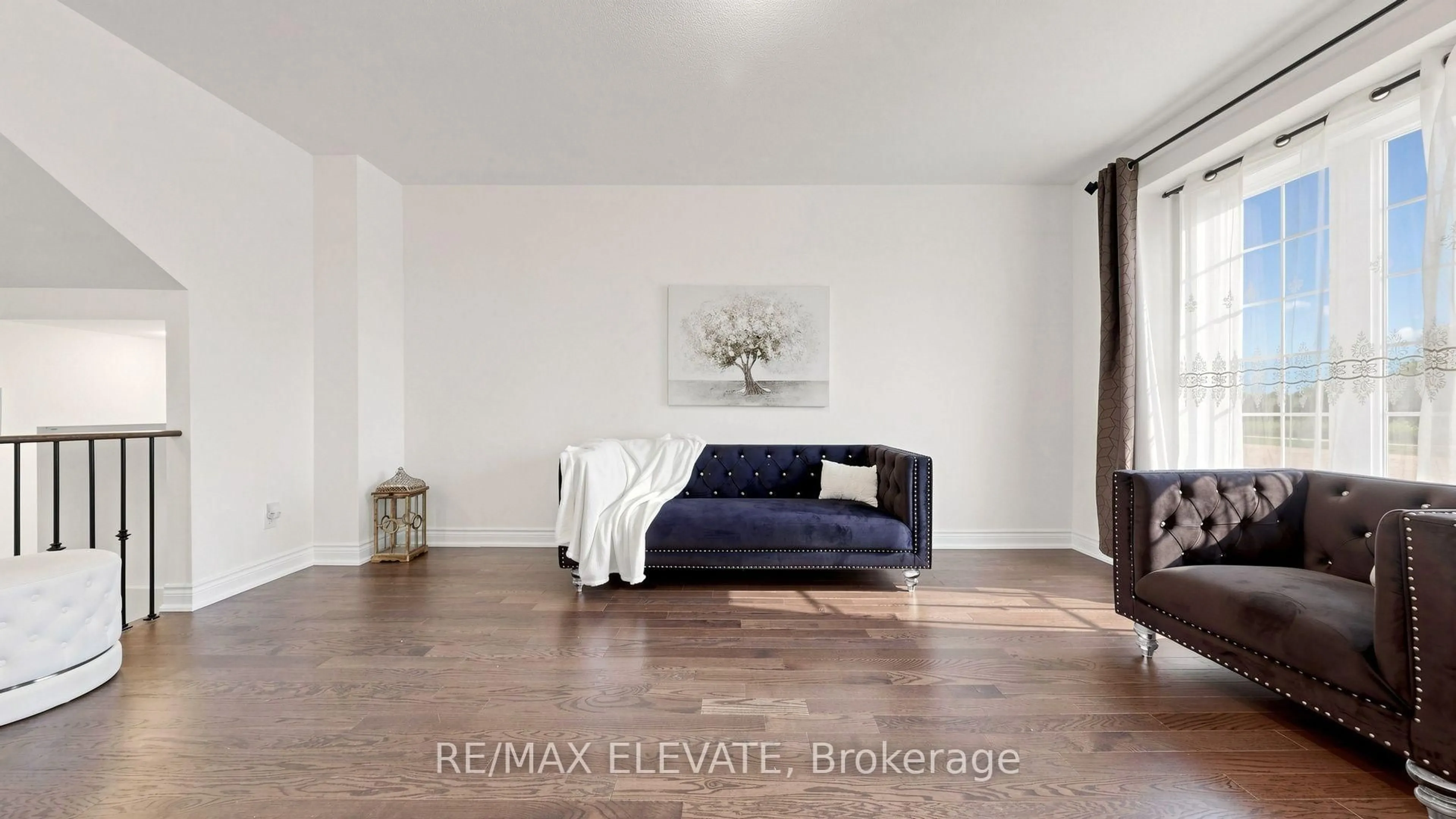 Living room with furniture, wood/laminate floor for 265 Kirkham Dr, Markham Ontario L3S 0A9