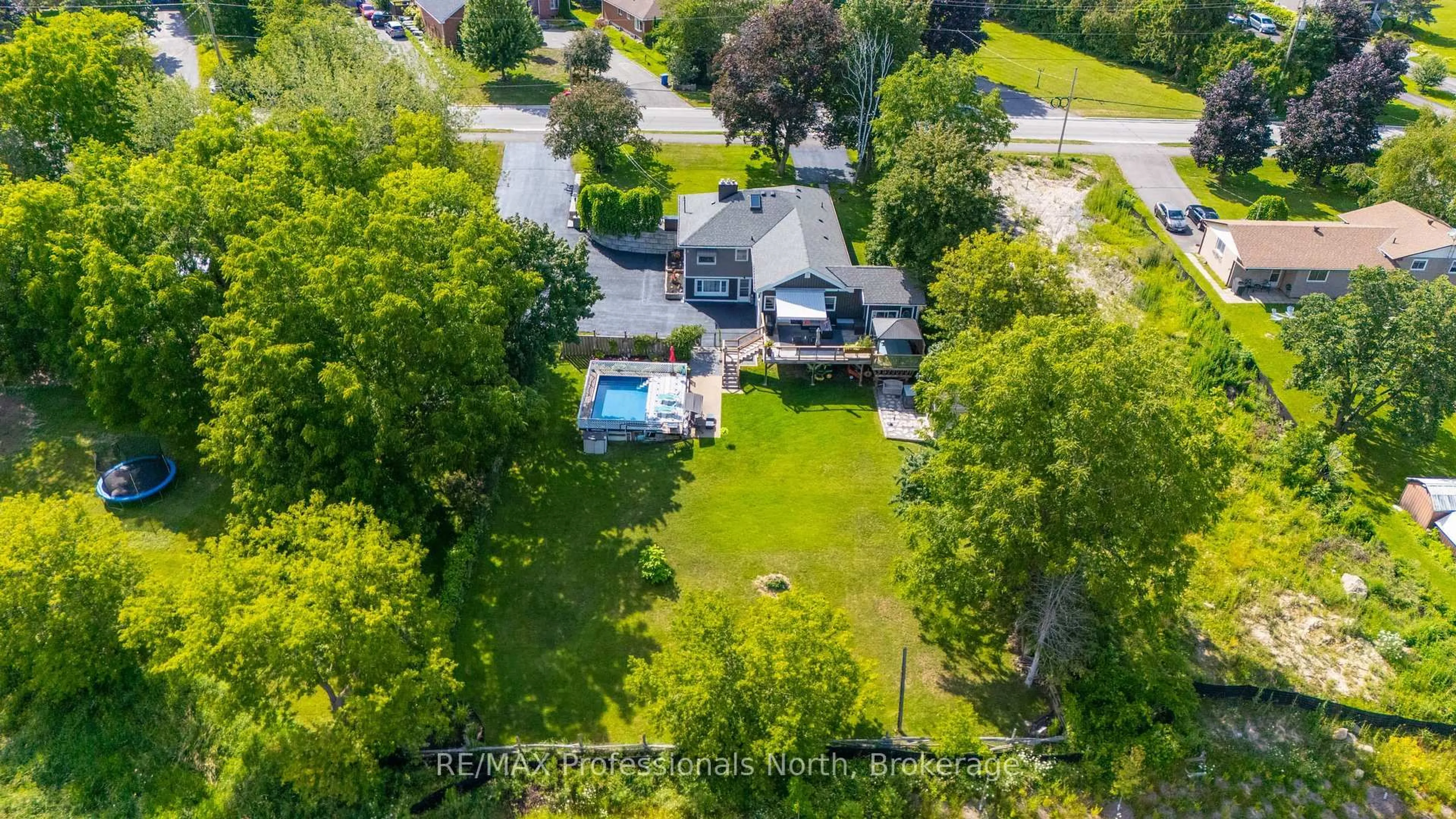 A pic from outside/outdoor area/front of a property/back of a property/a pic from drone, water/lake/river/ocean view for 63 The Queensway, Georgina Ontario L4P 0L2