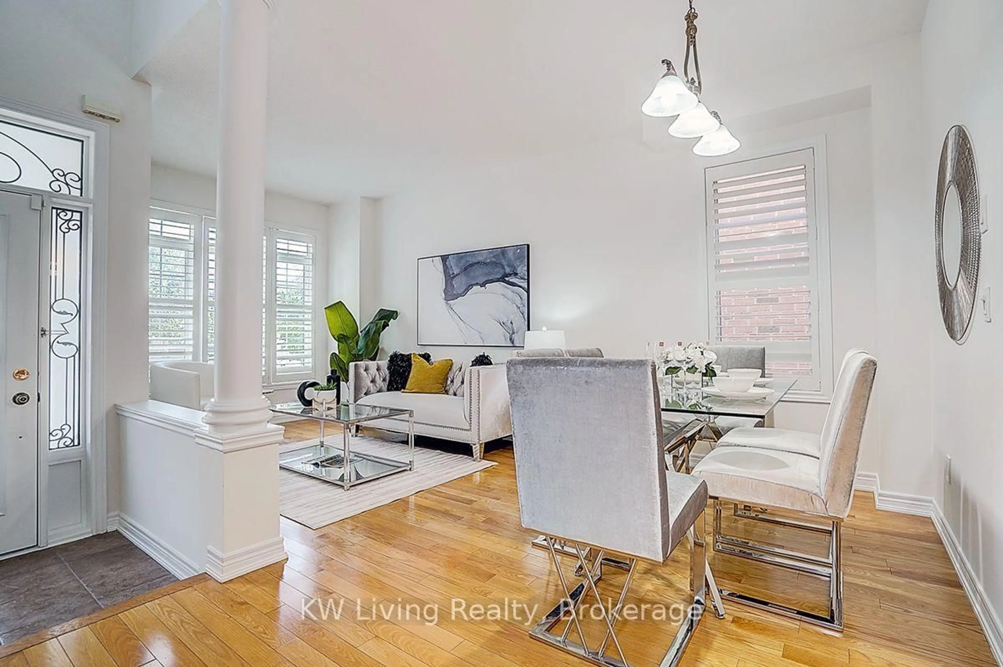Living room with furniture, wood/laminate floor for 16 Florelle Dr, Markham Ontario L6E 2H6
