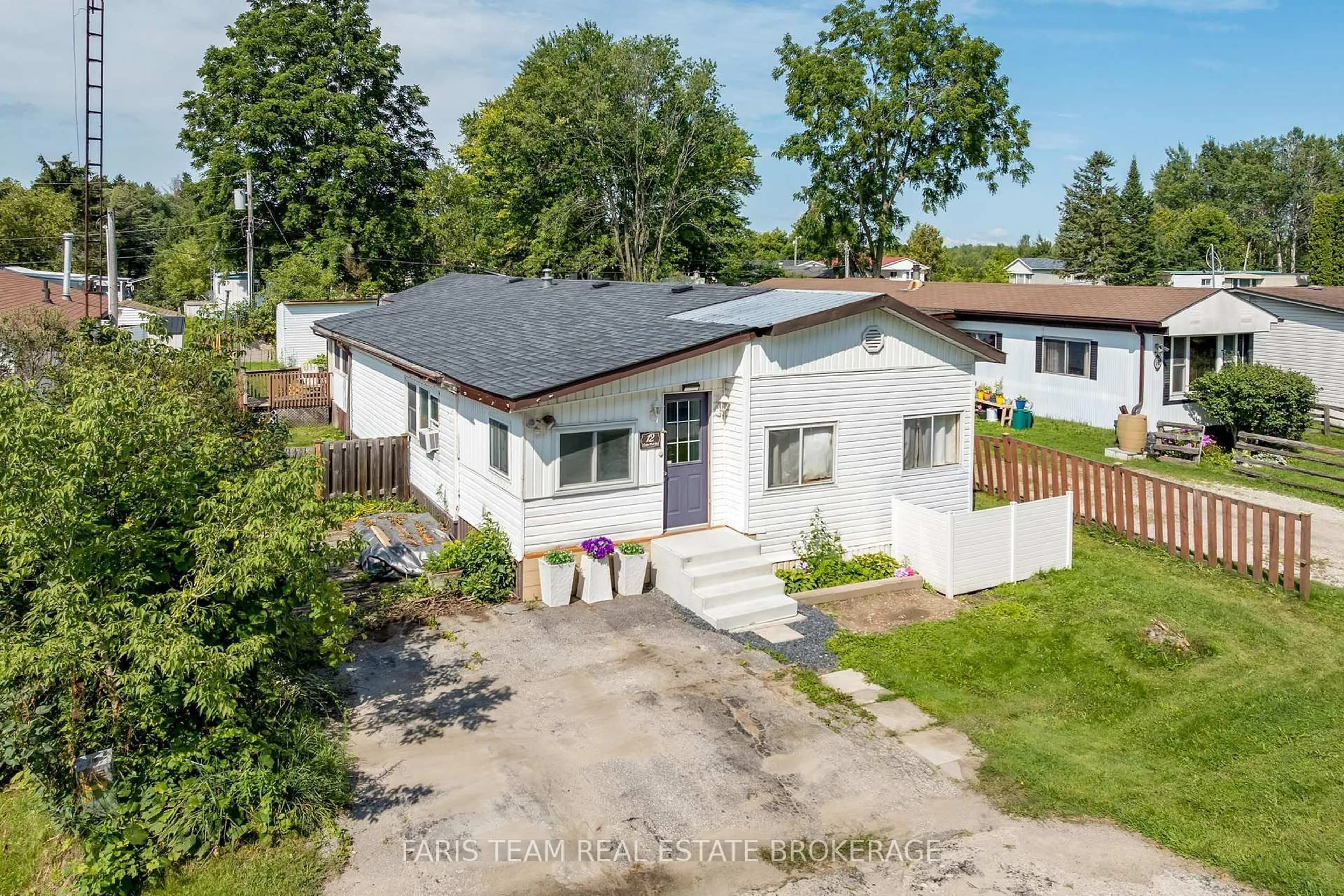 A pic from outside/outdoor area/front of a property/back of a property/a pic from drone, unknown for 12 Centre Park Rd, Essa Ontario L0M 1B1