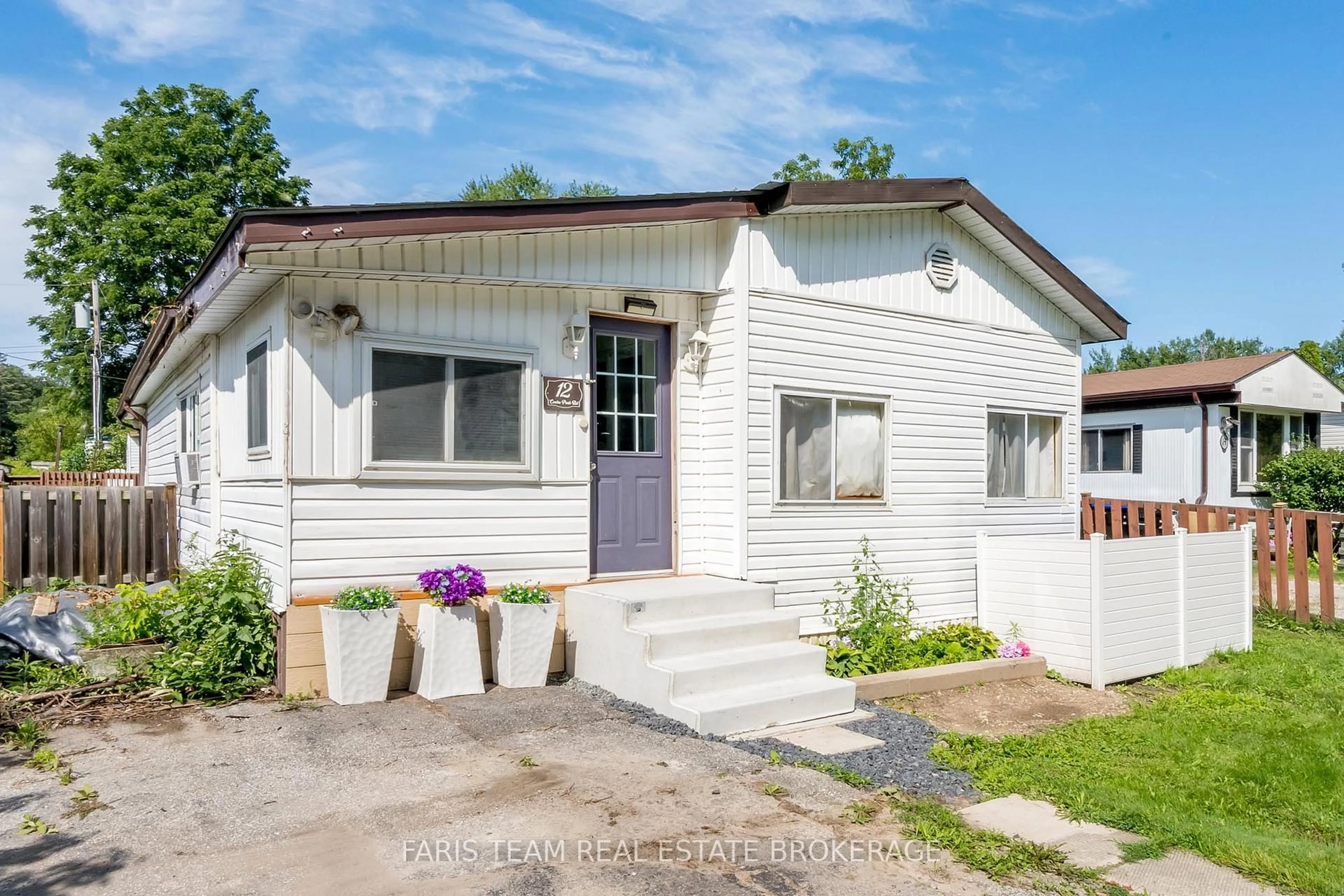 Home with vinyl exterior material, street for 12 Centre Park Rd, Essa Ontario L0M 1B1