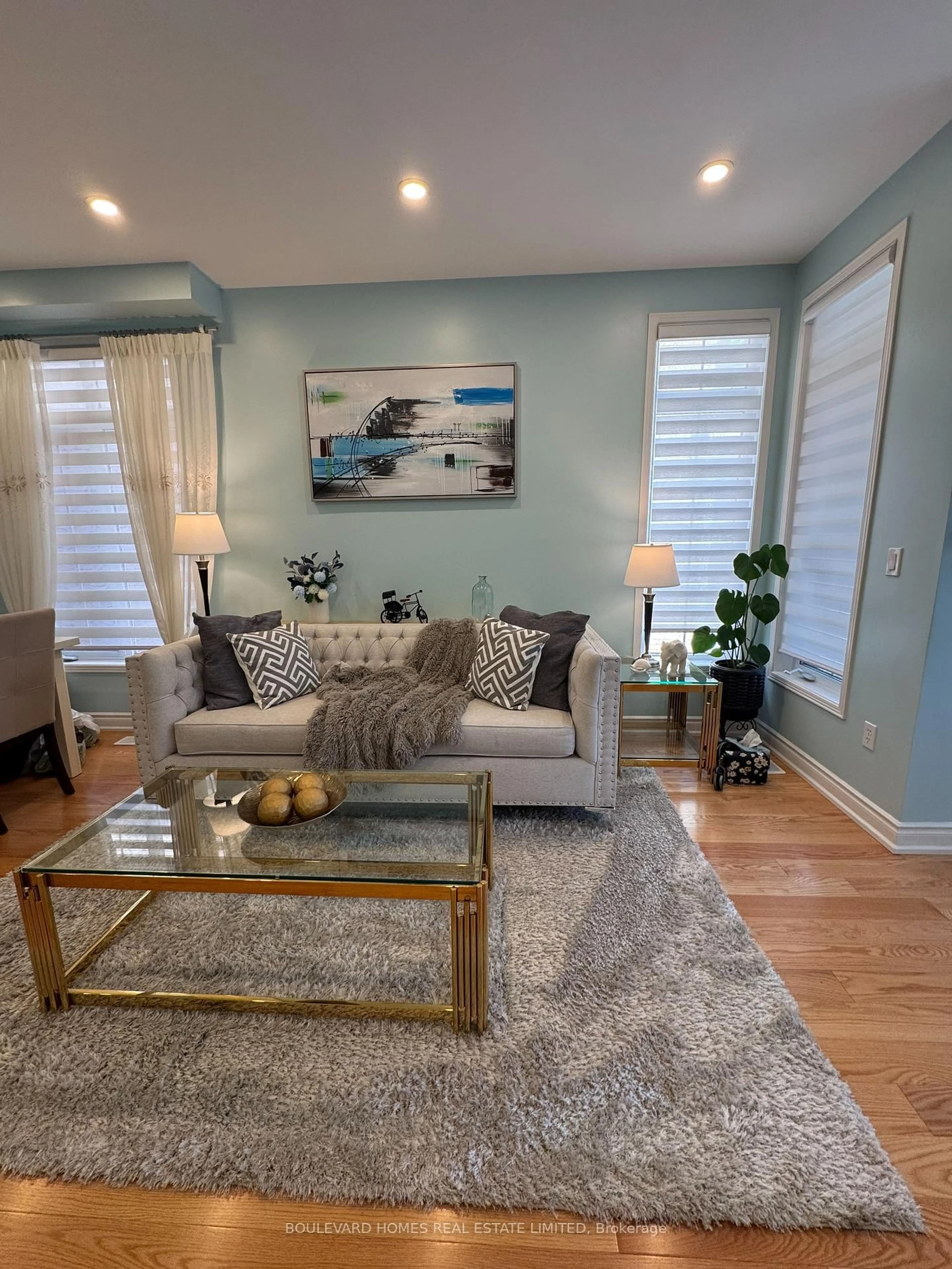 Living room with furniture, wood/laminate floor for 20 Russell Hill Rd, Markham Ontario L6C 2L8
