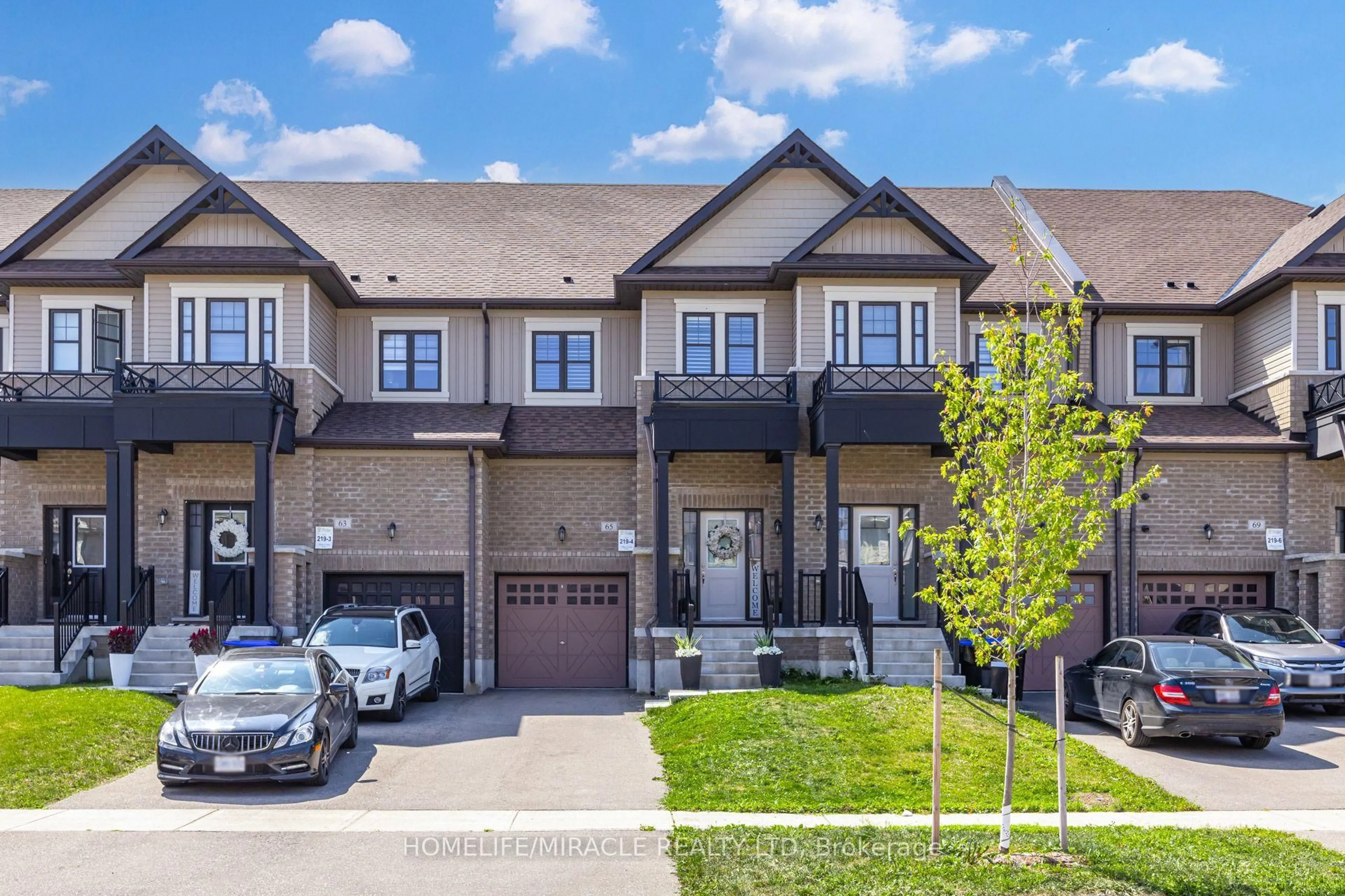 A pic from outside/outdoor area/front of a property/back of a property/a pic from drone, street for 65 Lorne Thomas Pl, New Tecumseth Ontario L9R 0V8