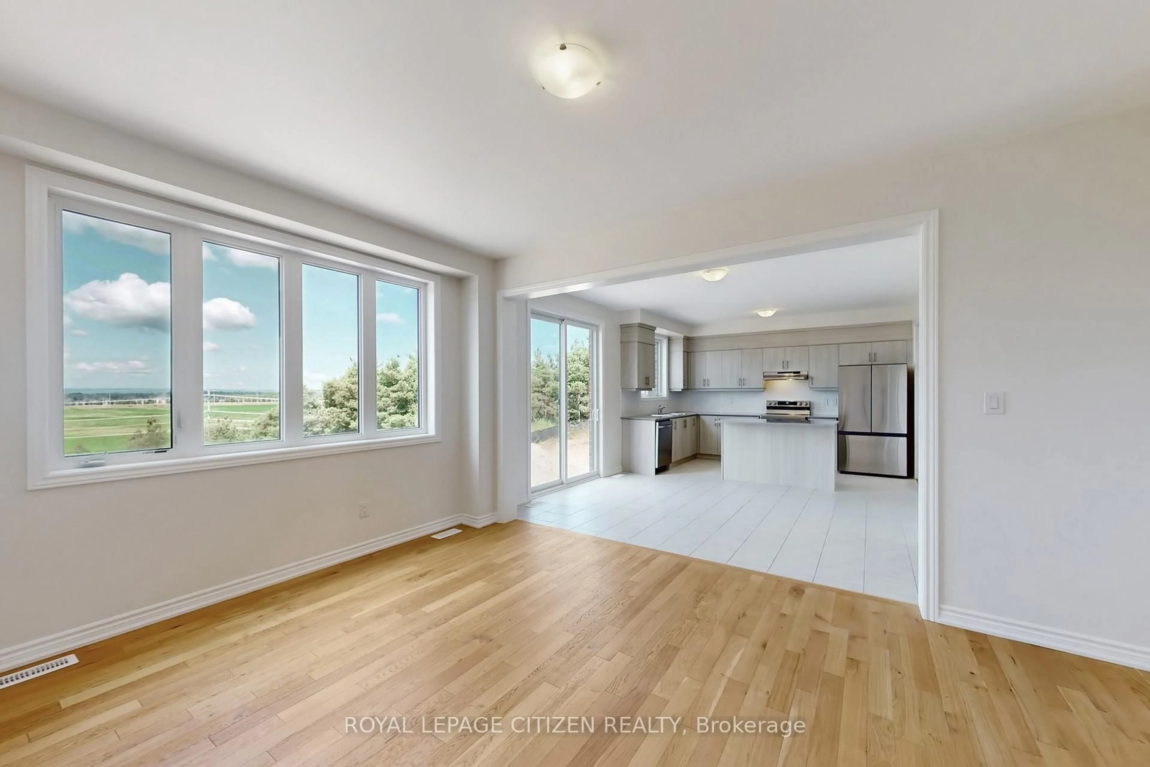 Open concept kitchen, unknown for 82 Lawrence D. Pridham Ave, New Tecumseth Ontario L9R 0X1