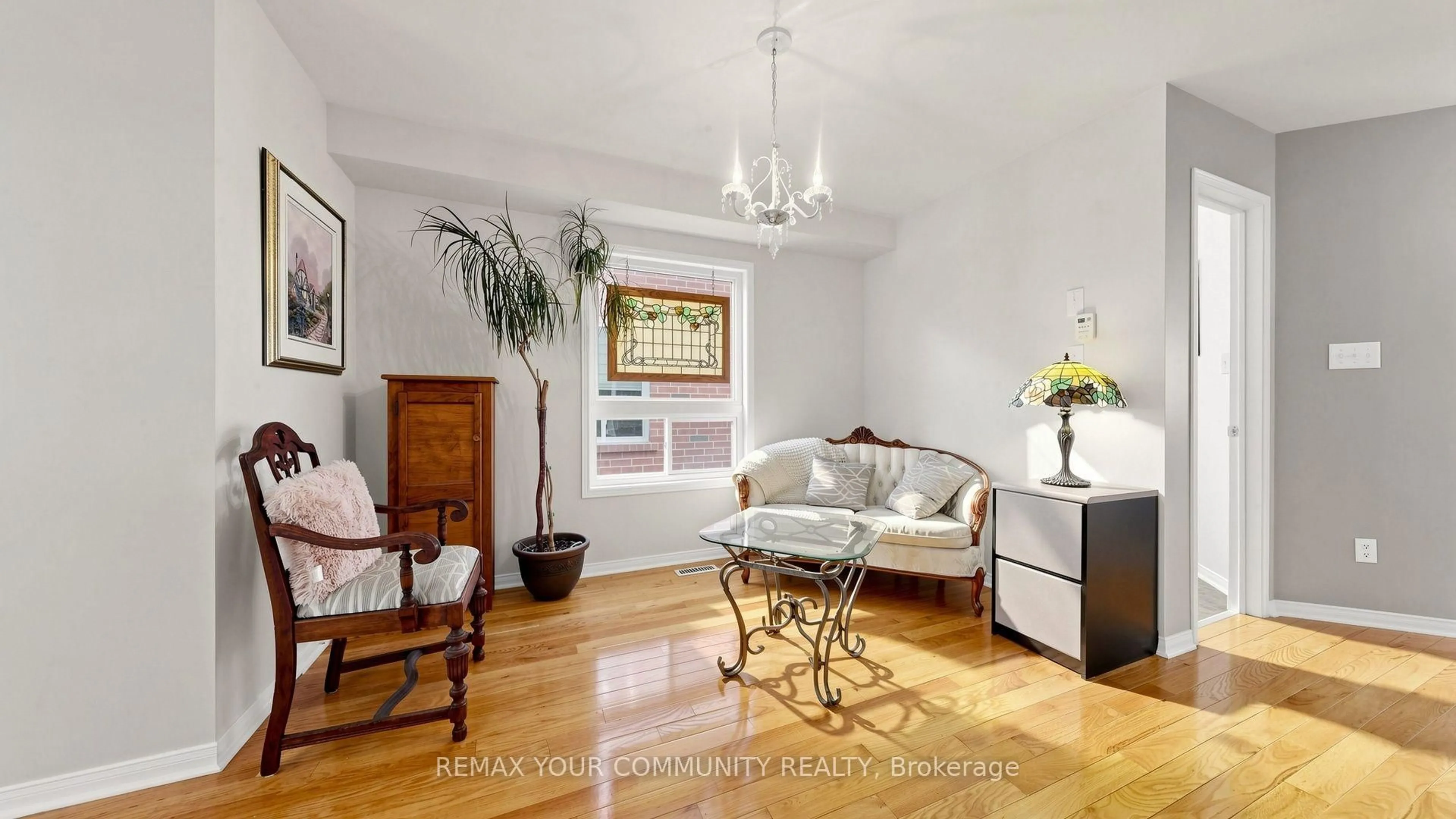 Living room with furniture, wood/laminate floor for 230 Hammersly Blvd, Markham Ontario L6E 2C9