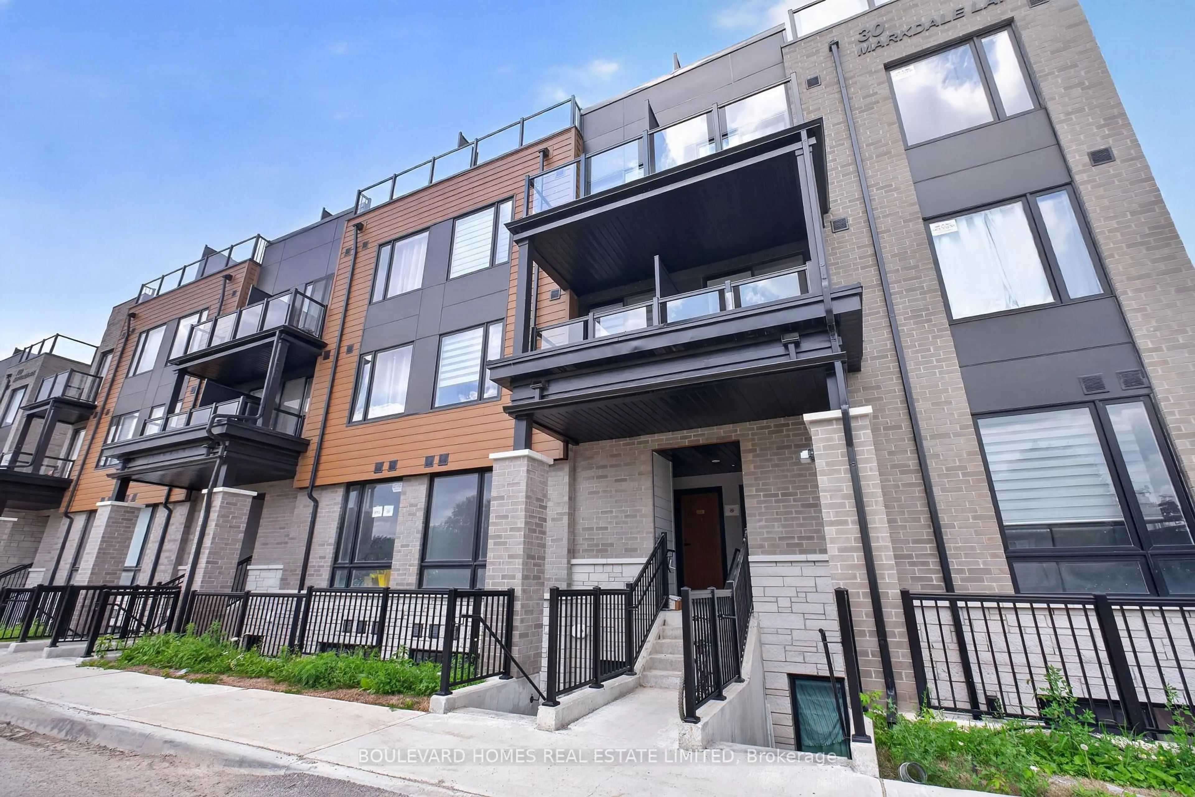Home with brick exterior material, street for 30 Markdale Lane #13, Markham Ontario L3S 0E3