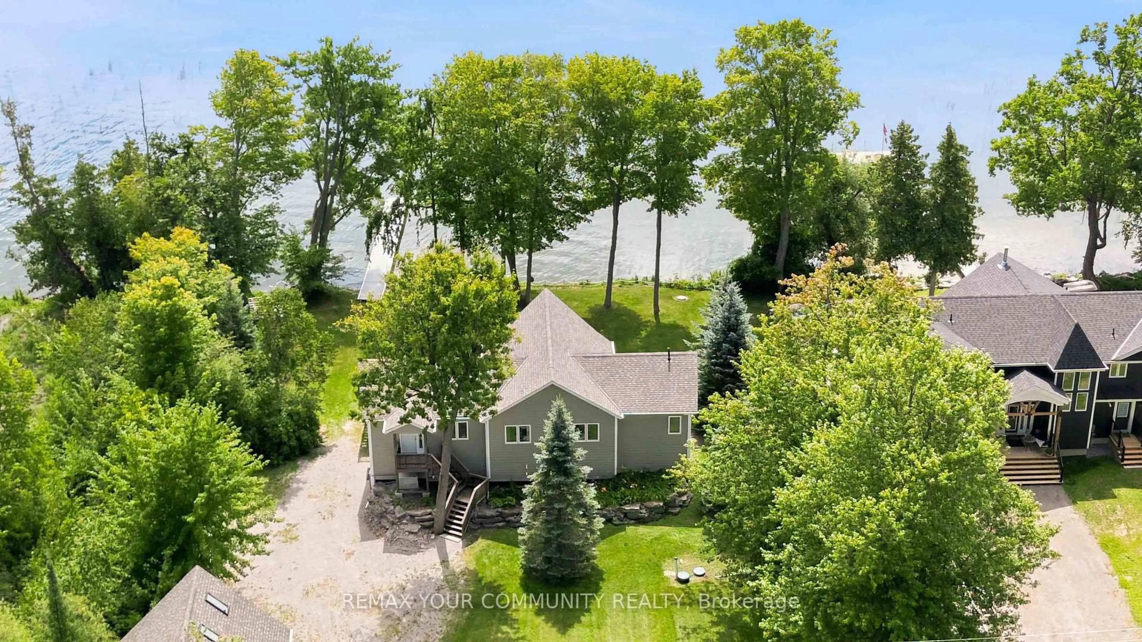 A pic from outside/outdoor area/front of a property/back of a property/a pic from drone, forest/trees view for 386 Bear Rd, Georgina Islands Ontario L0E 1R0