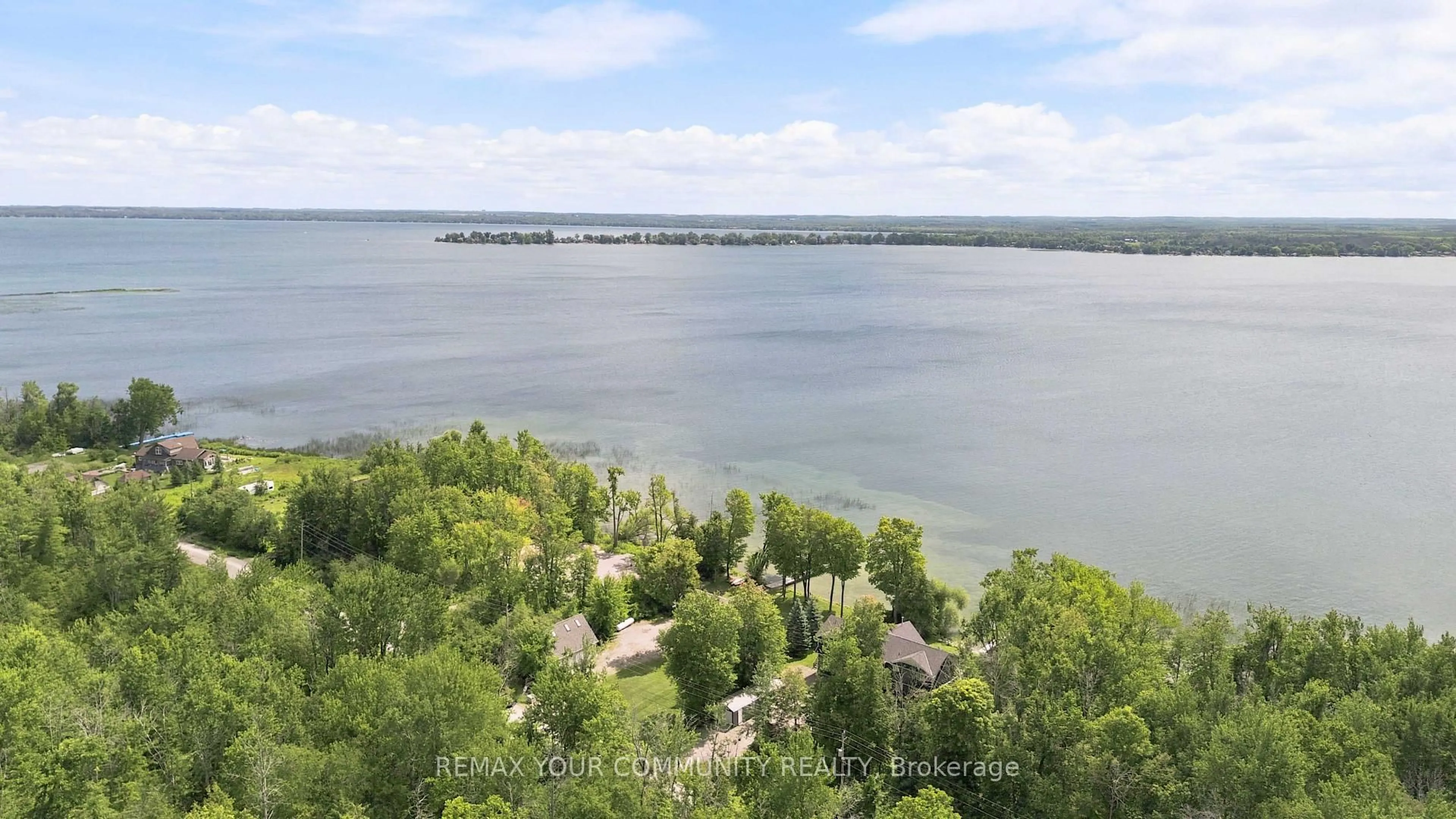 A pic from outside/outdoor area/front of a property/back of a property/a pic from drone, water/lake/river/ocean view for 386 Bear Rd, Georgina Islands Ontario L0E 1R0