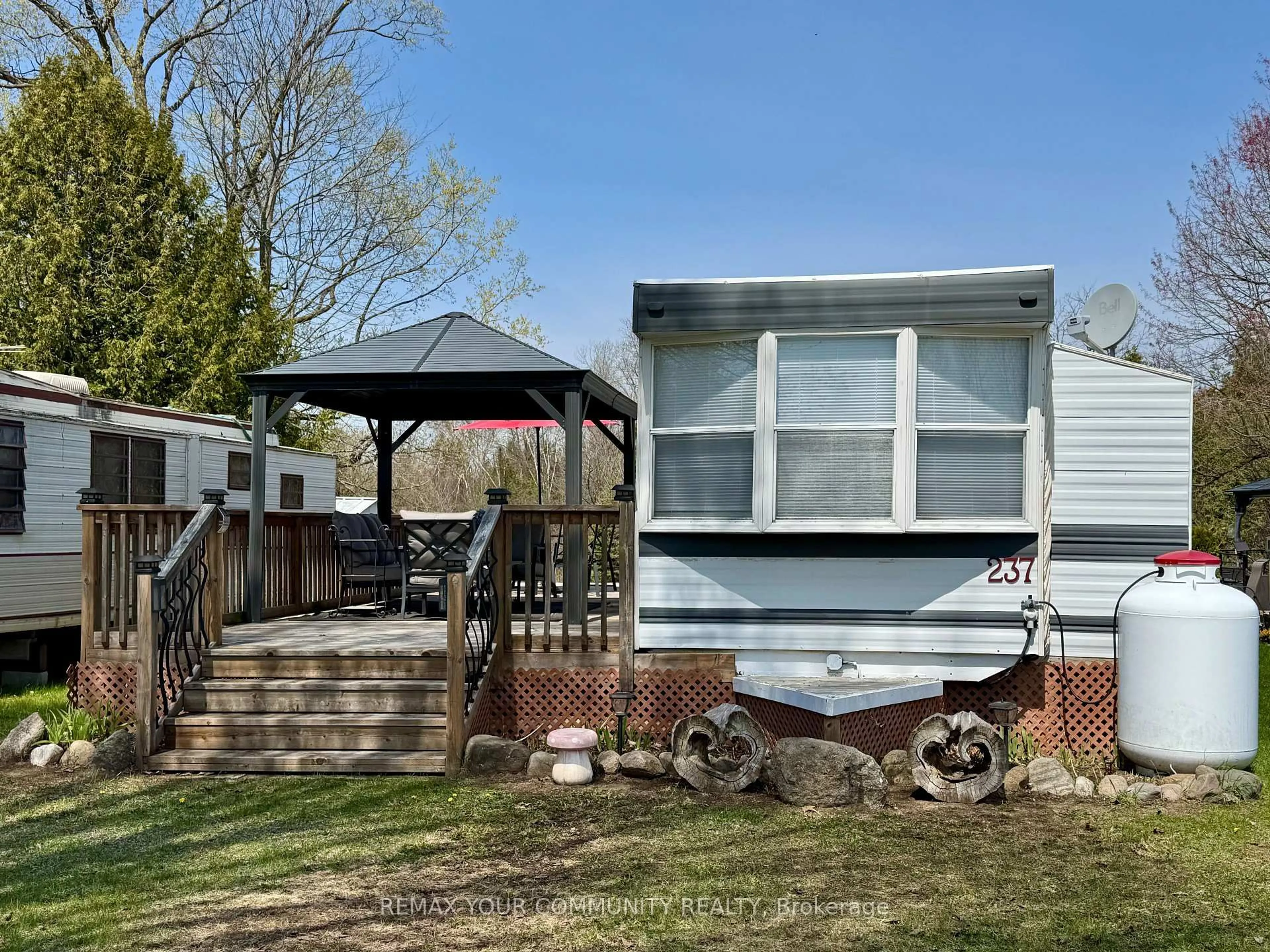 Home with vinyl exterior material, street for 285 Crydermans Sdrd #237, Georgina Ontario L0E 1A0