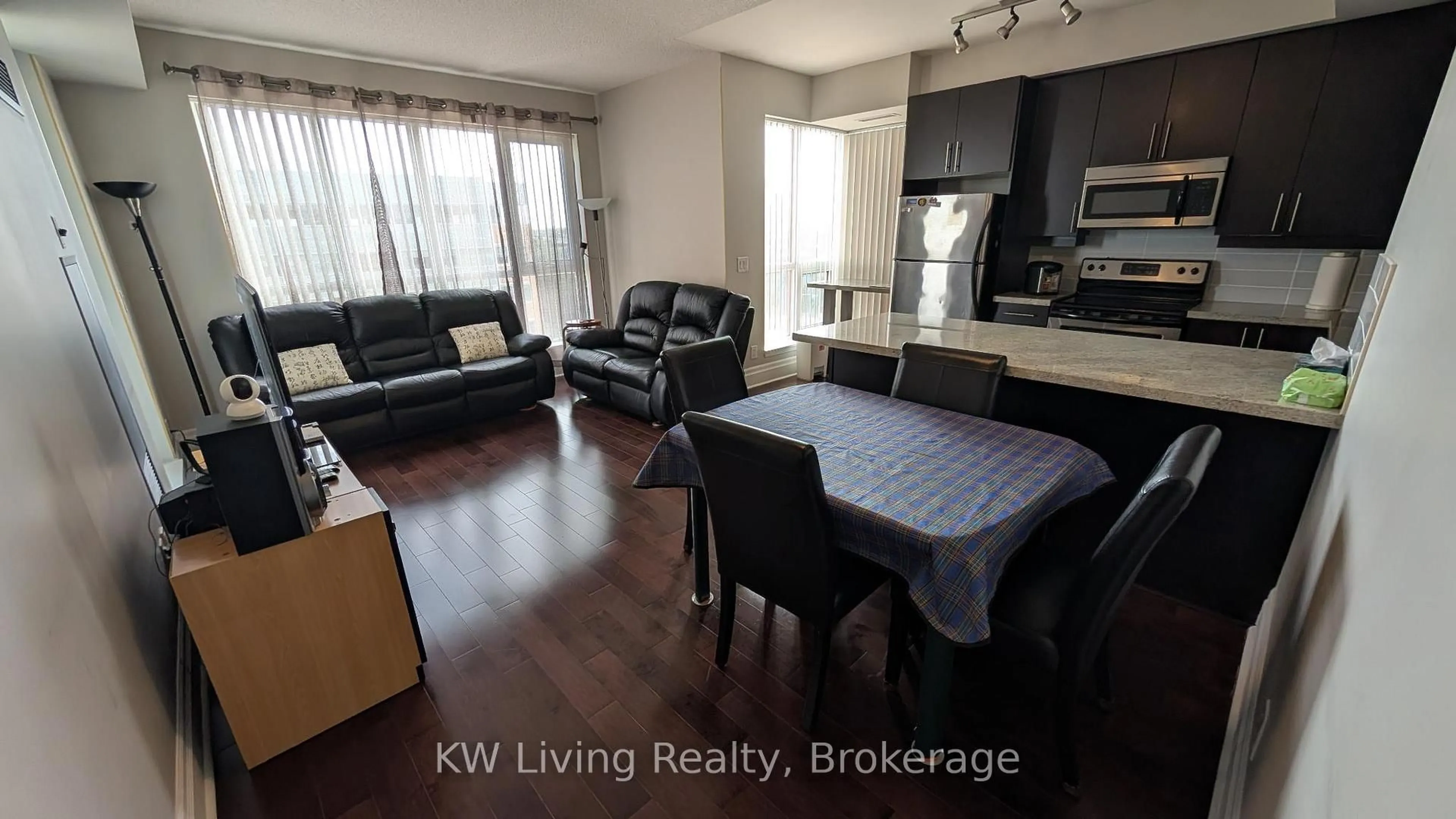 Living room with furniture, wood/laminate floor for 21 Upper Duke Cres #610B, Markham Ontario L6G 0B6