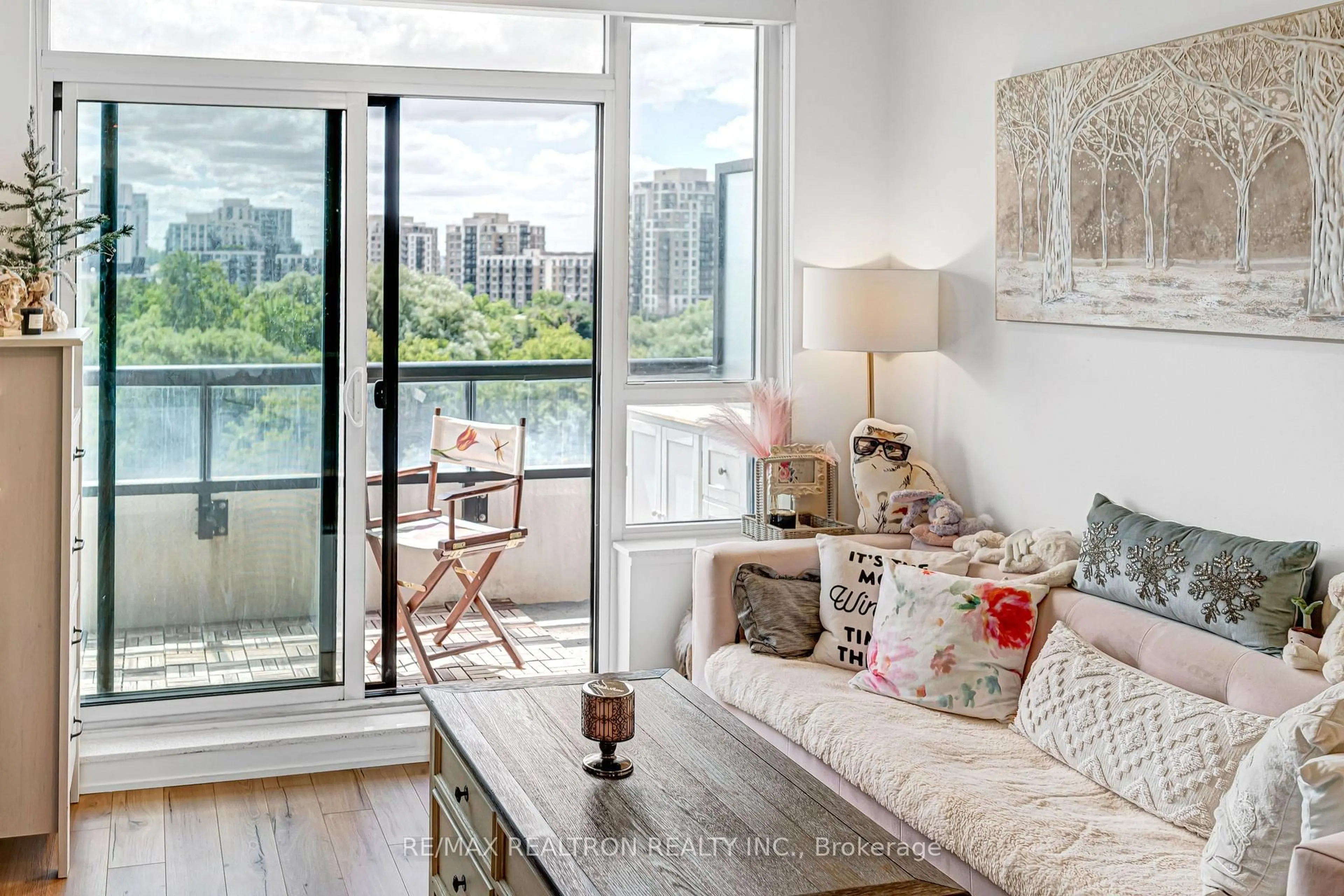 Living room with furniture, wood/laminate floor for 15 Water Walk Dr #715, Markham Ontario L6G 0G2