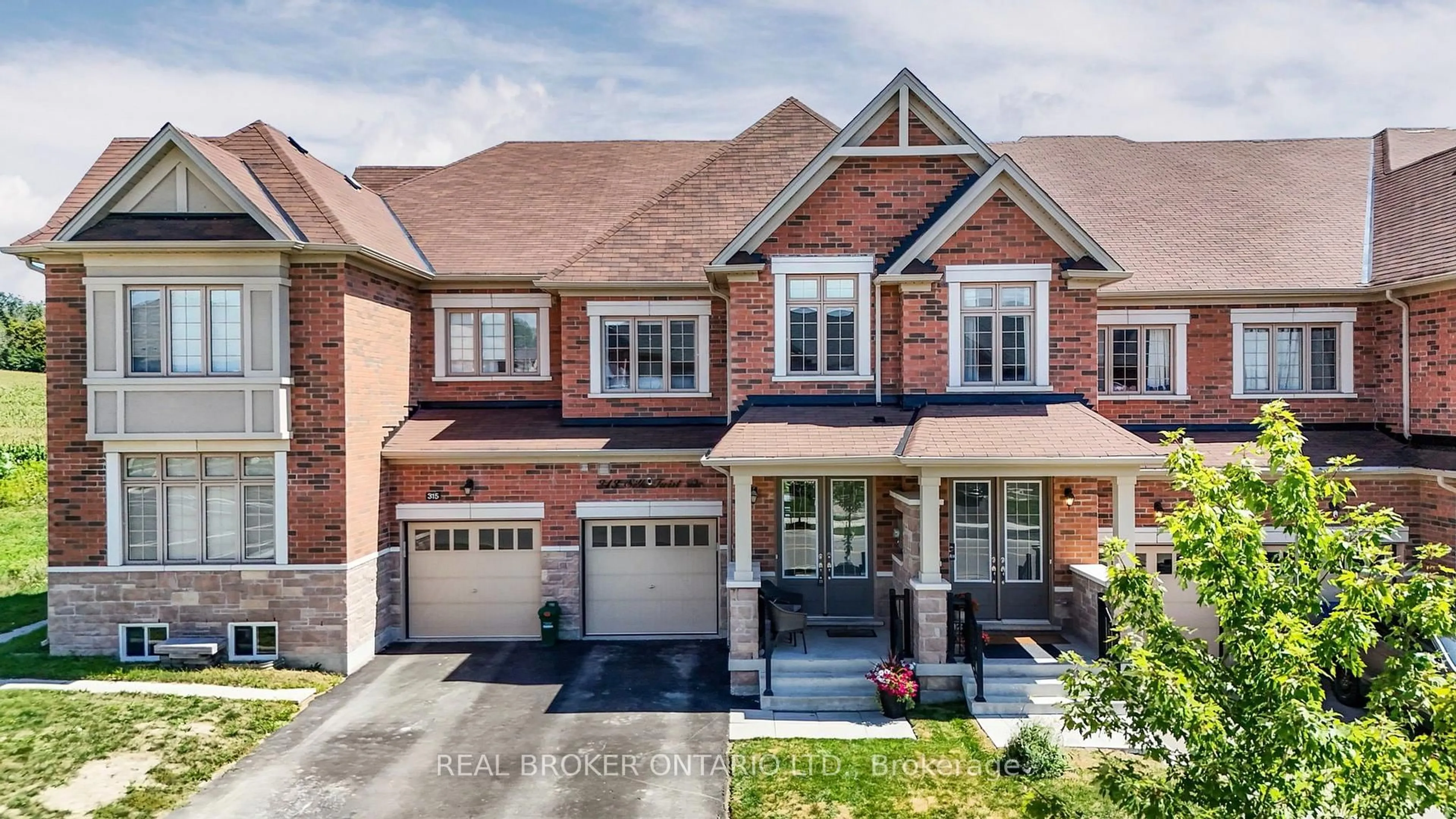 Home with brick exterior material, street for 313 Silk Twist Dr, East Gwillimbury Ontario L9N 0V4