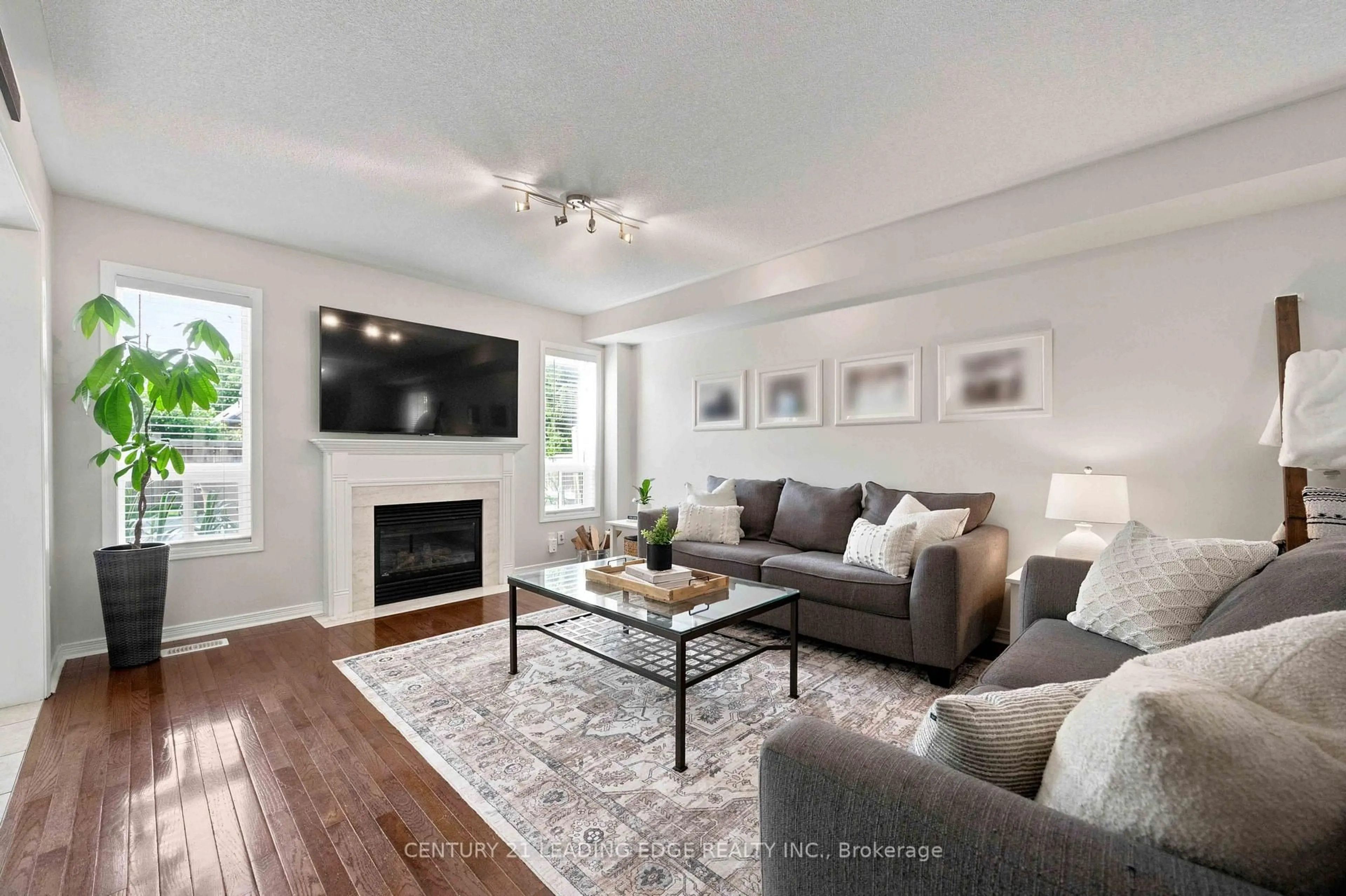 Living room with furniture, wood/laminate floor for 16 Bolster Lane, Uxbridge Ontario L9P 2A3