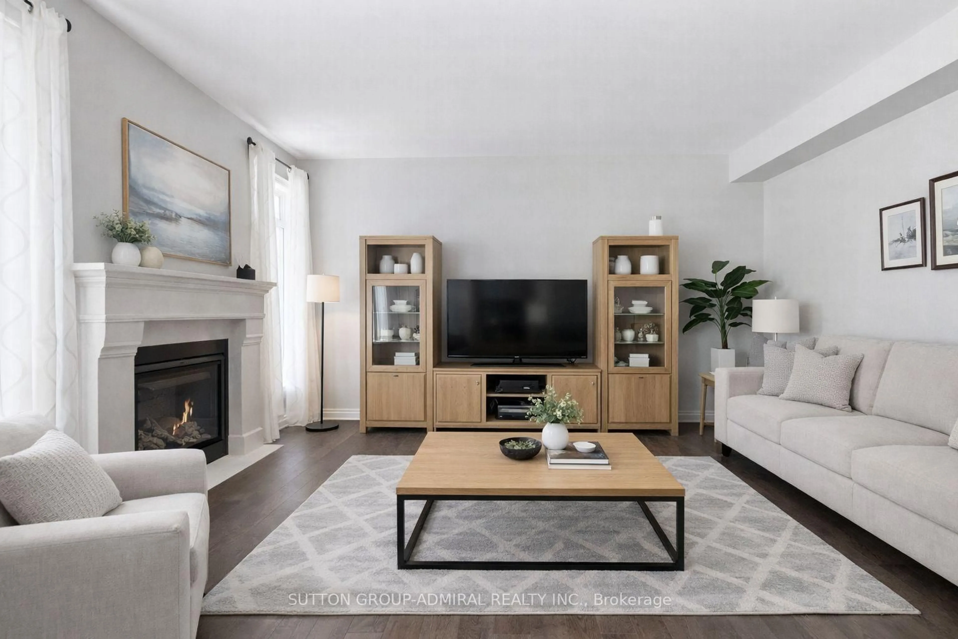 Living room with furniture, wood/laminate floor for 1 Citrine Dr, Bradford West Gwillimbury Ontario L3Z 0T5