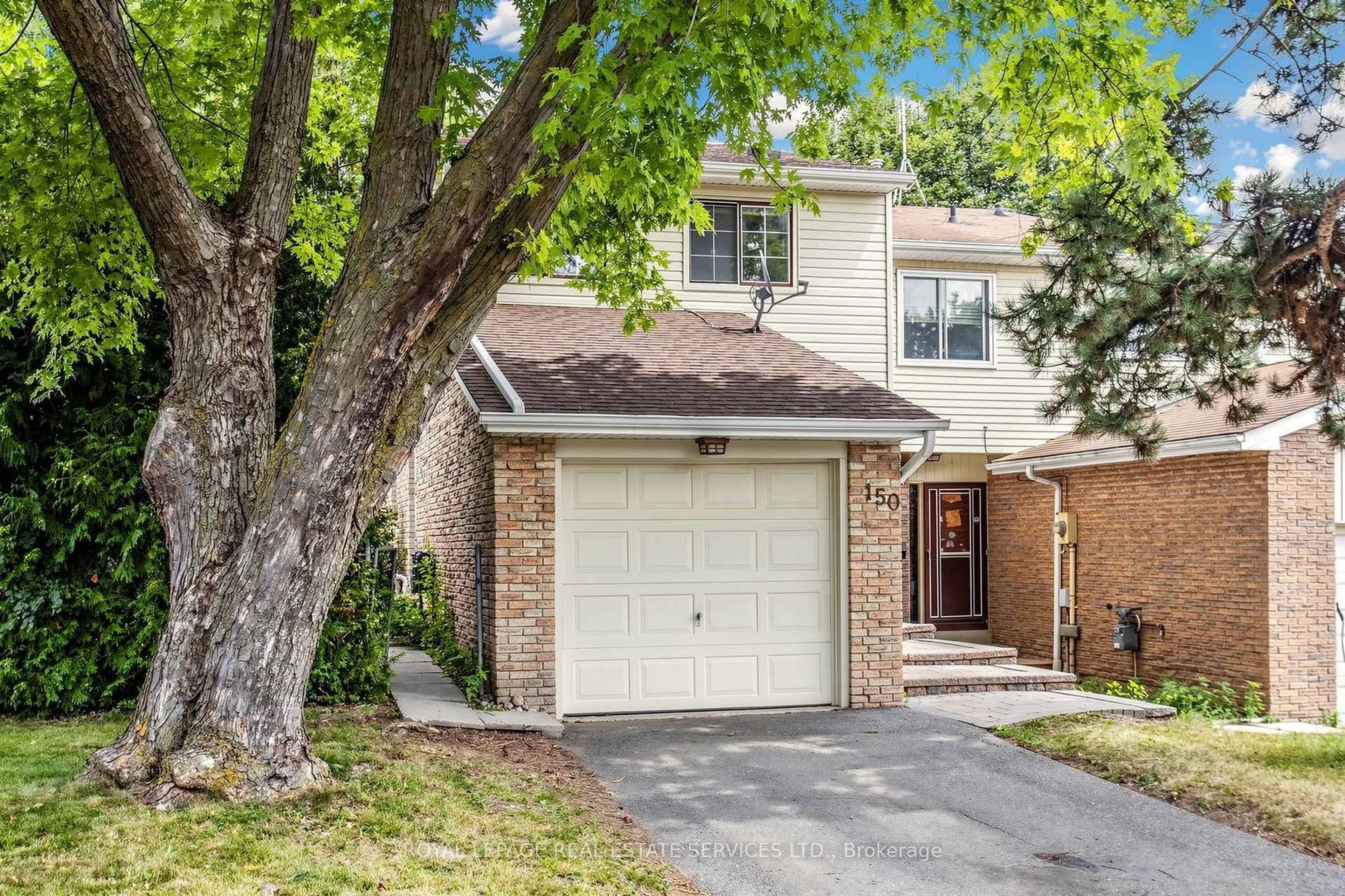 Home with brick exterior material, street for 150 Tamarack Dr, Markham Ontario L3T 4X4