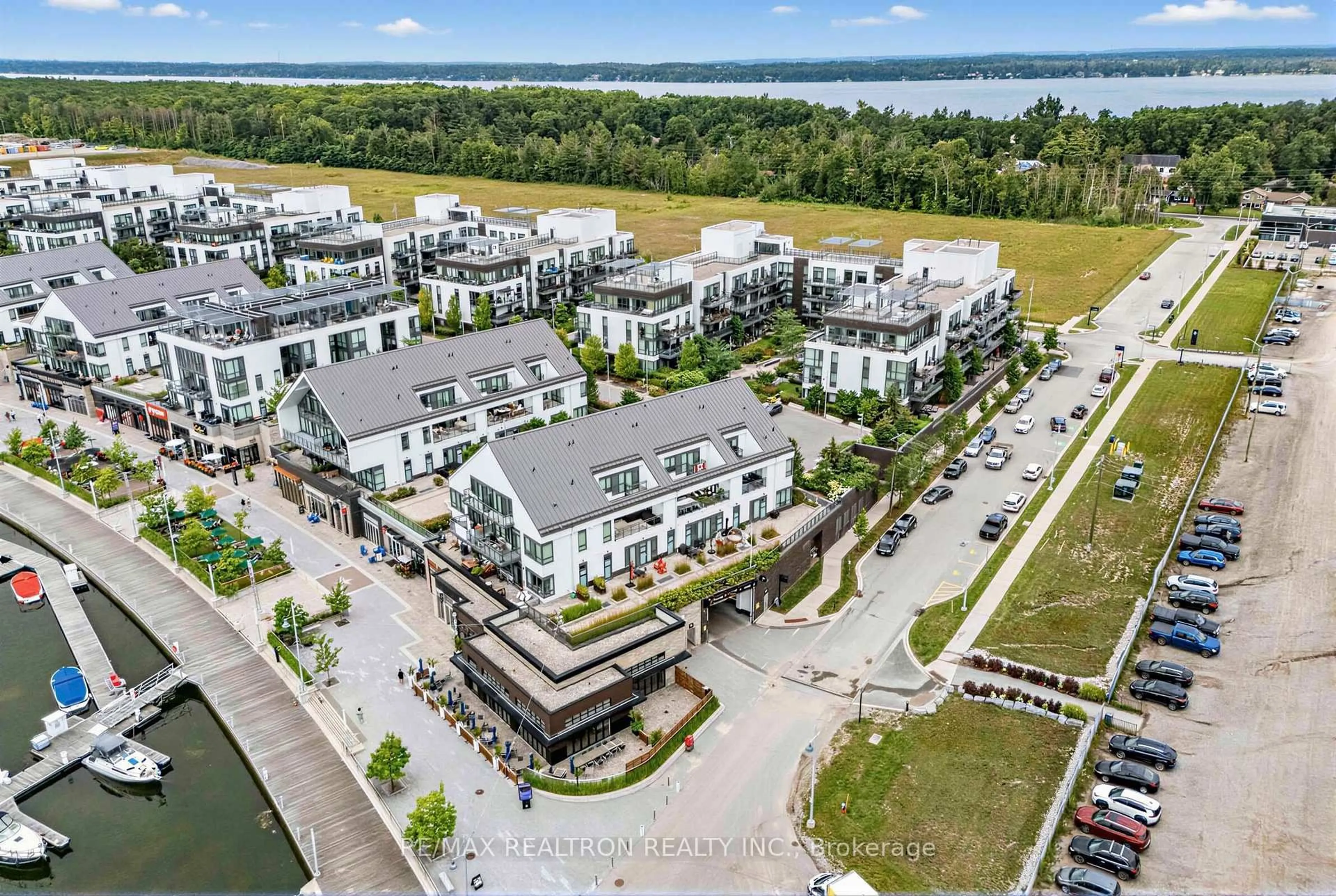 A pic from outside/outdoor area/front of a property/back of a property/a pic from drone, water/lake/river/ocean view for 233 Broward Way #8, Innisfil Ontario L9S 0M5