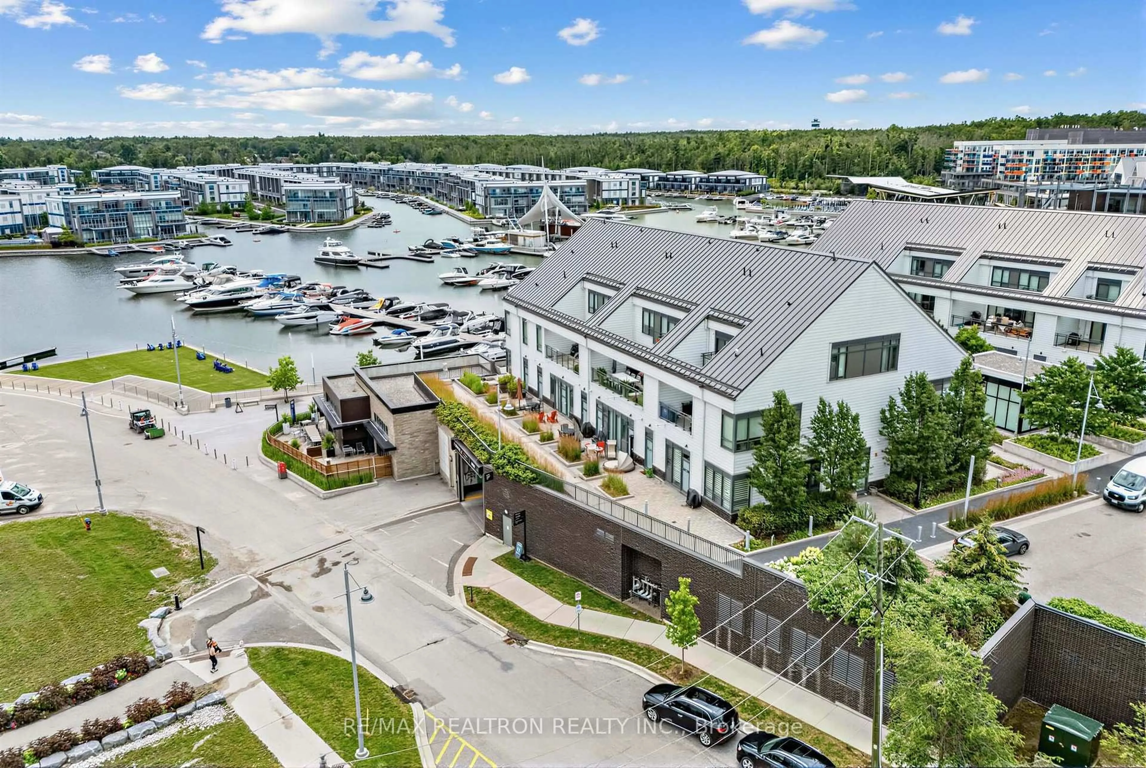 A pic from outside/outdoor area/front of a property/back of a property/a pic from drone, water/lake/river/ocean view for 233 Broward Way #8, Innisfil Ontario L9S 0M5