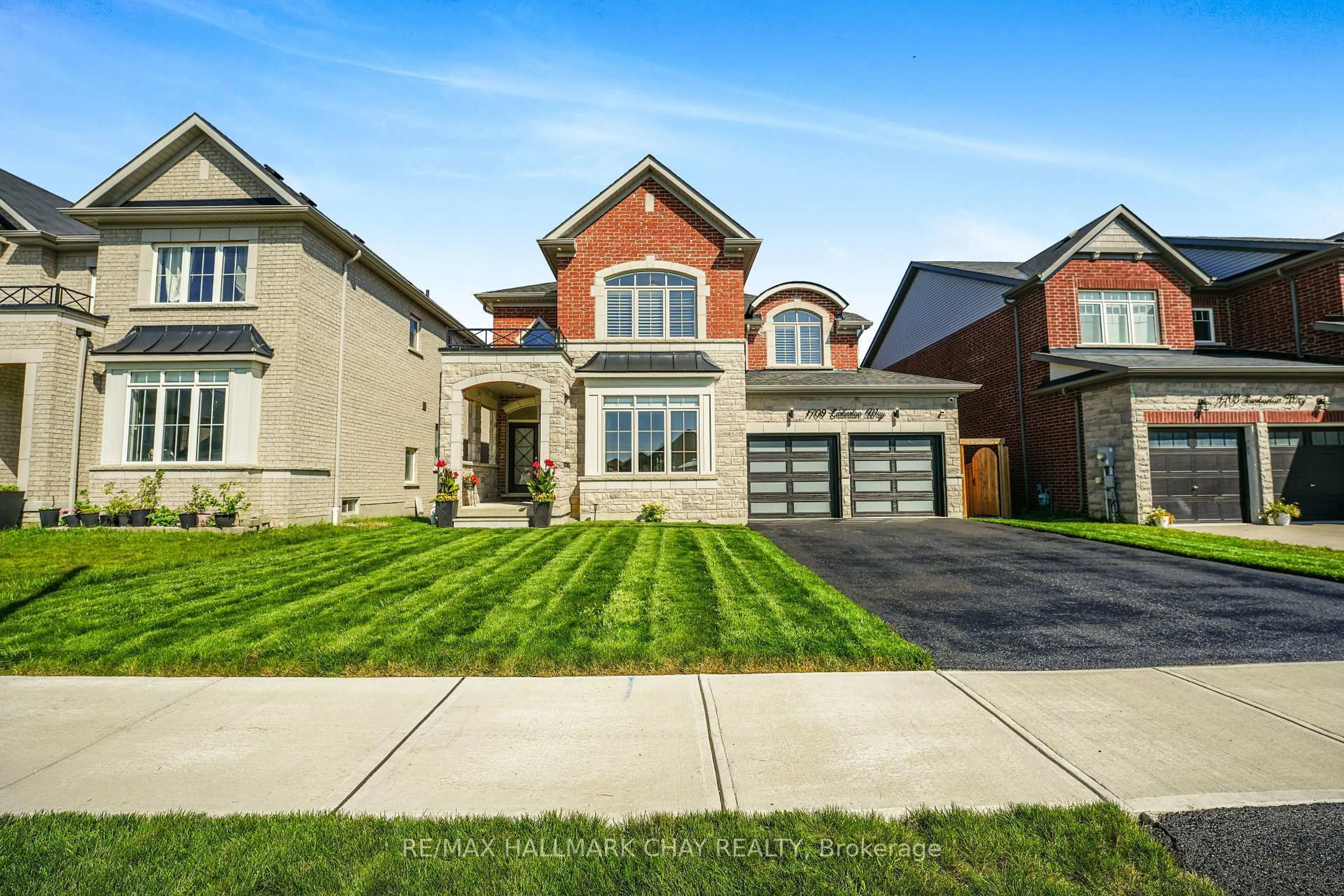Home with brick exterior material, street for 1709 Emberton Way, Innisfil Ontario L9S 0N4
