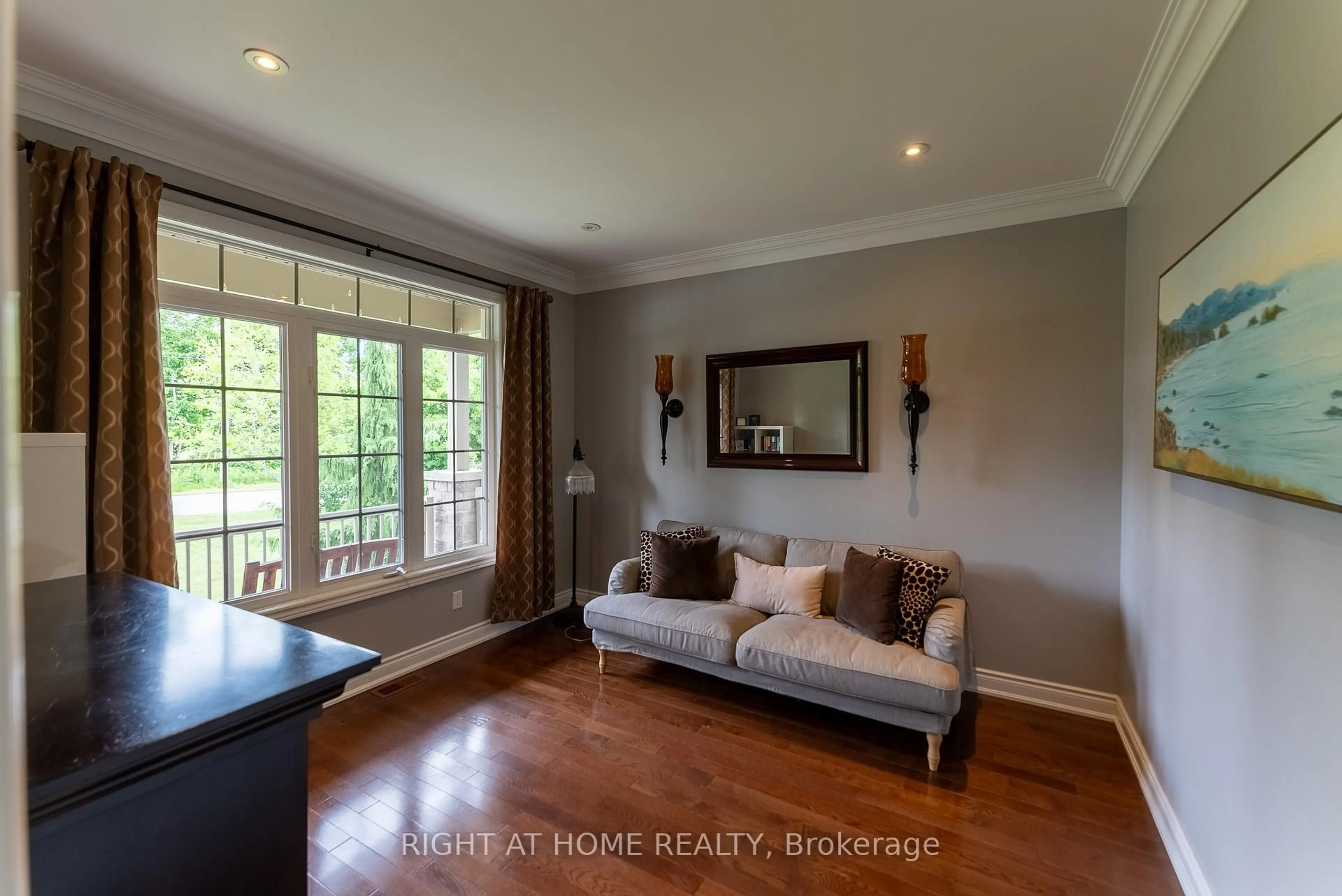 Living room with furniture, wood/laminate floor for 1660 Moyer Ave, Innisfil Ontario L9S 1S8