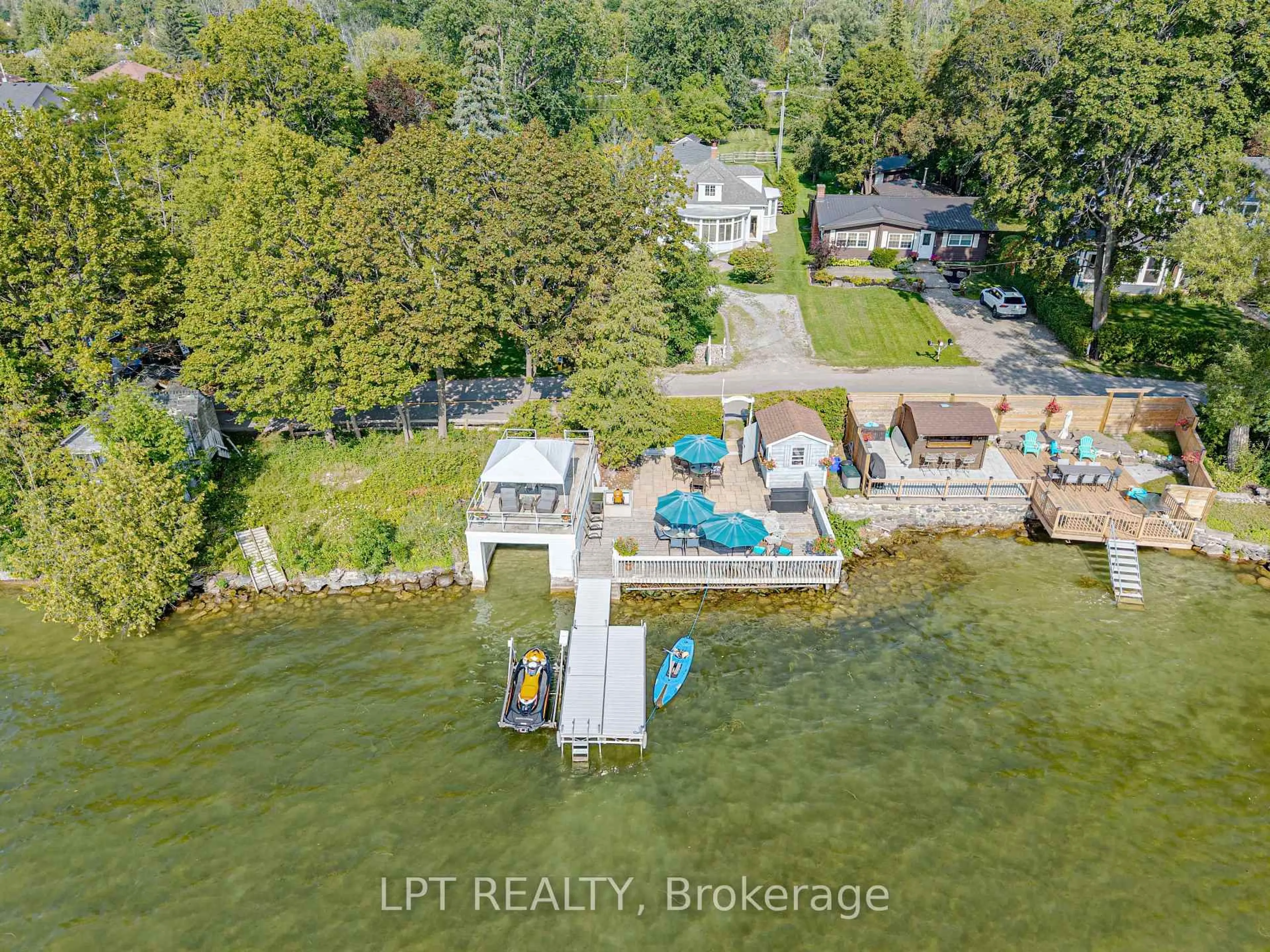 A pic from outside/outdoor area/front of a property/back of a property/a pic from drone, water/lake/river/ocean view for 357 Lake Dr, Georgina Ontario L4P 3C8