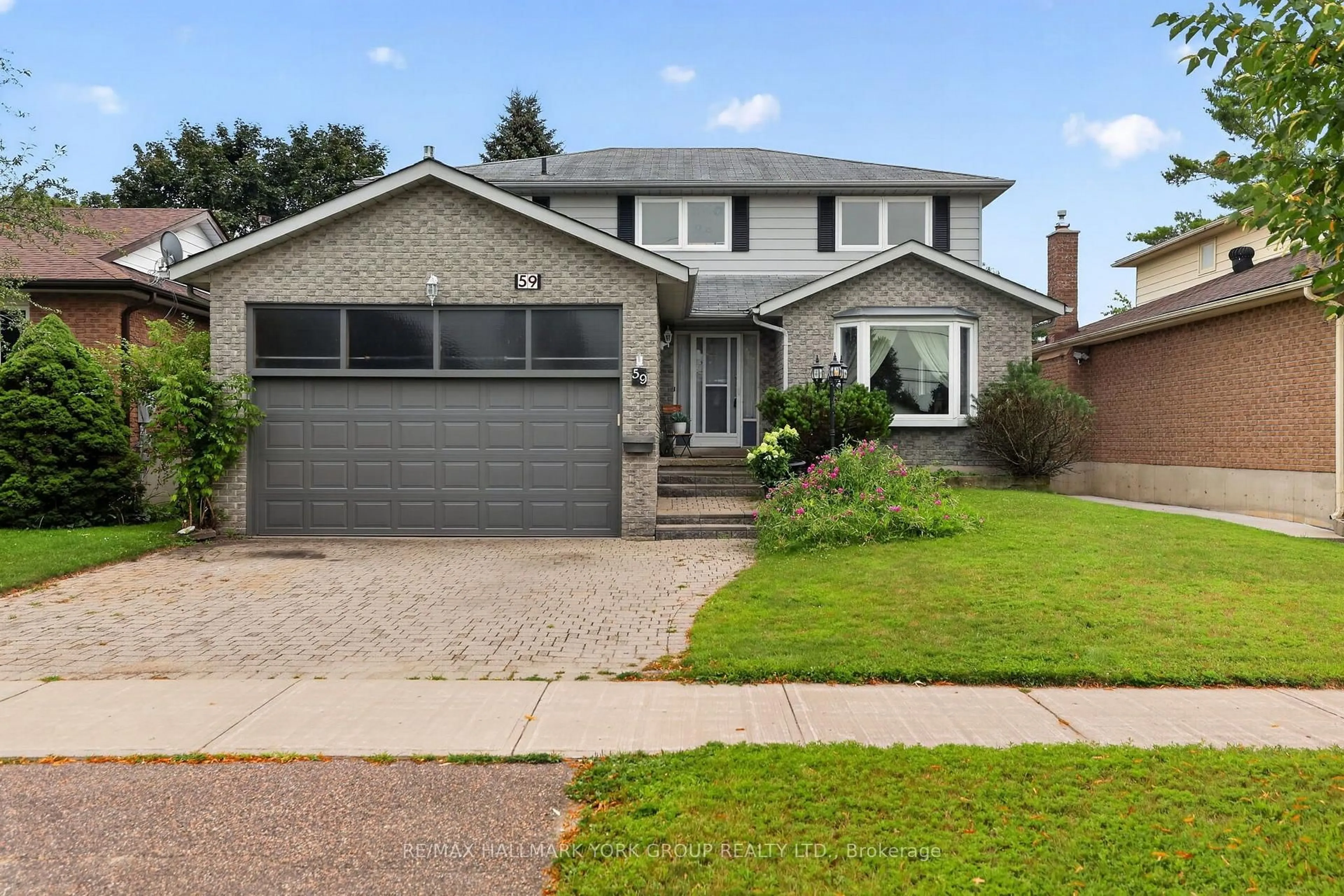 Home with brick exterior material, street for 59 Riverglen Dr, Georgina Ontario L4P 3K7