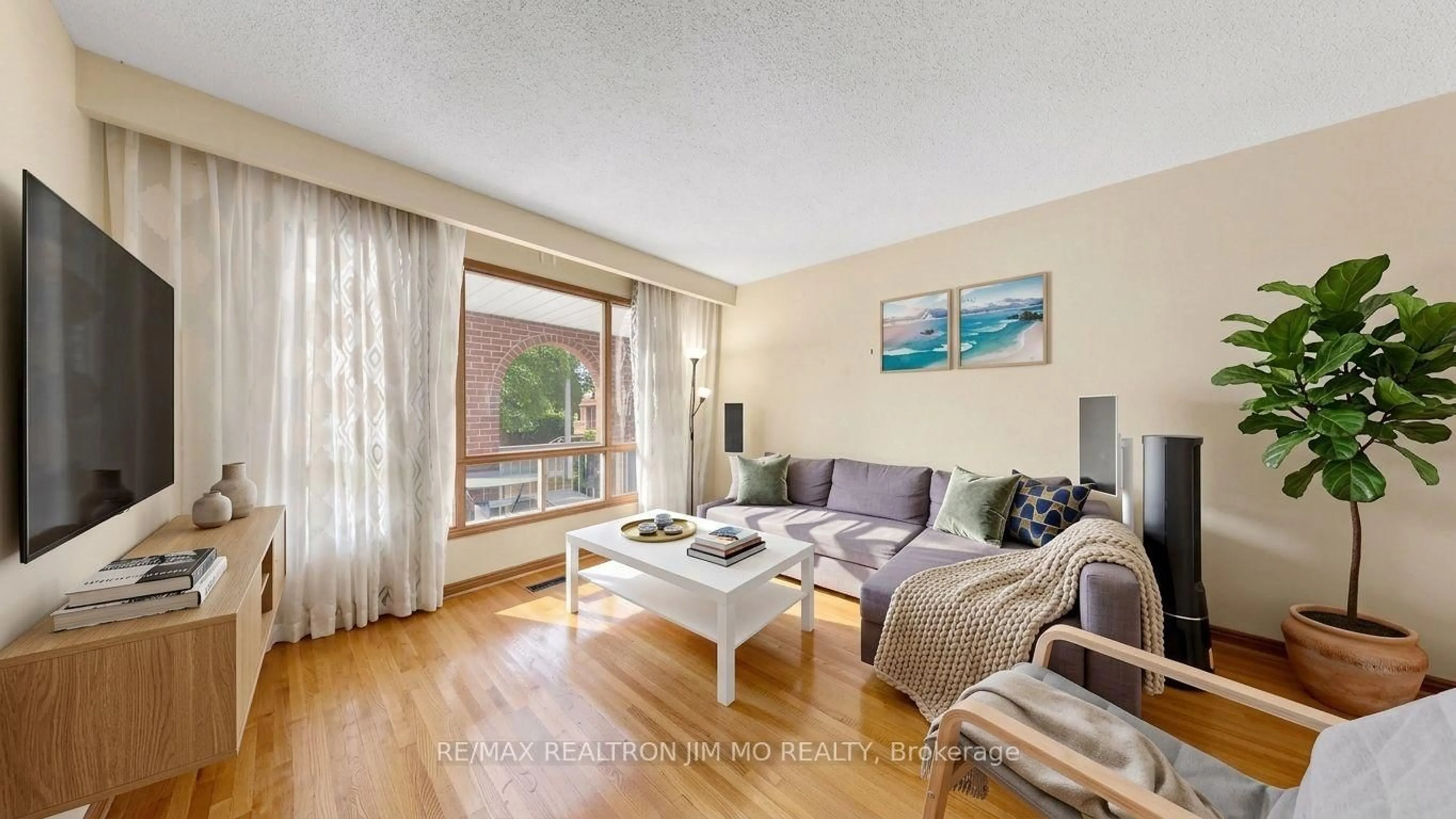 Living room with furniture, wood/laminate floor for 211 Risebrough Crct, Markham Ontario L3R 3J1