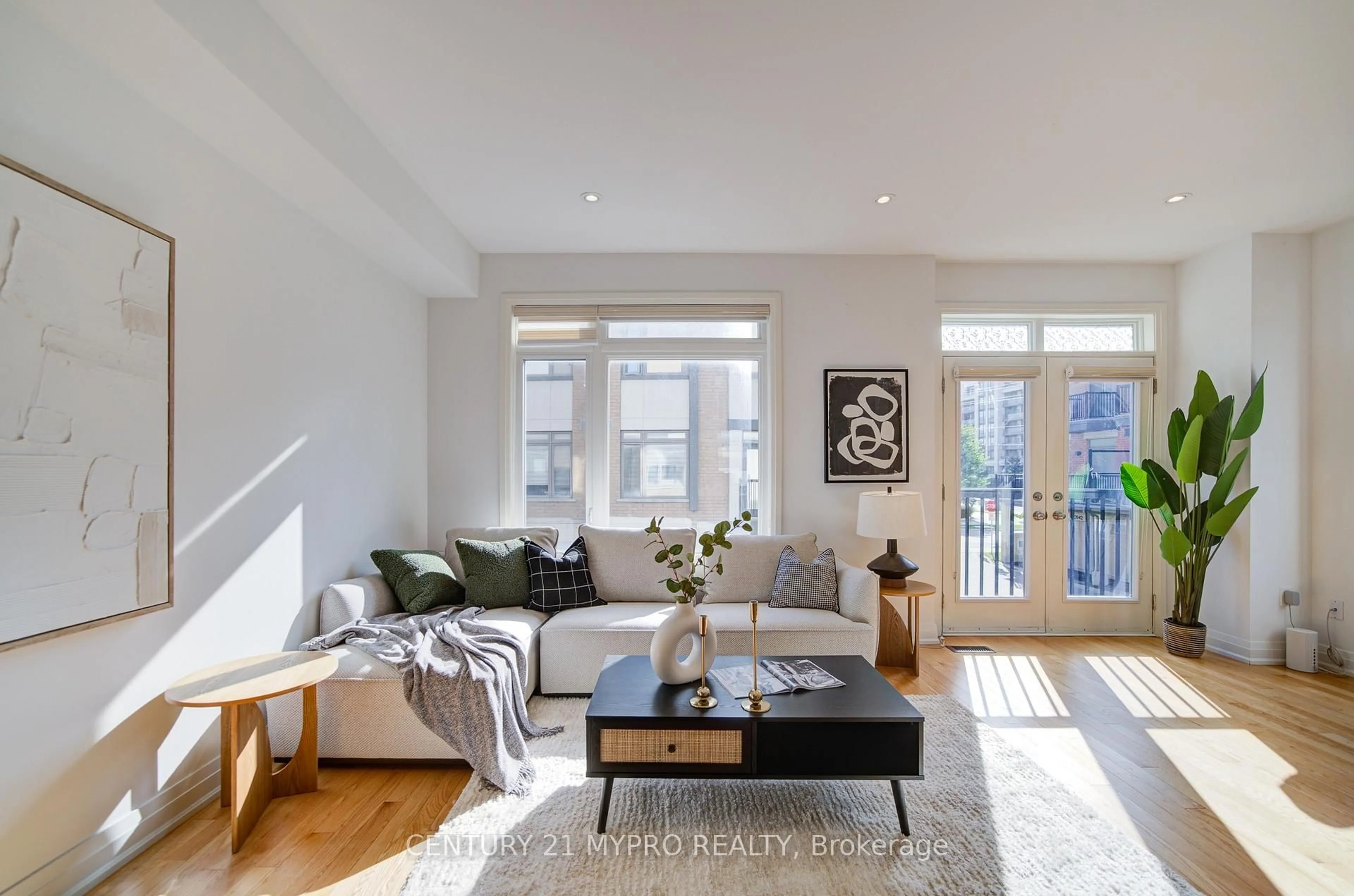 Living room with furniture, wood/laminate floor for 40 Teasel Way, Markham Ontario L3R 9S3