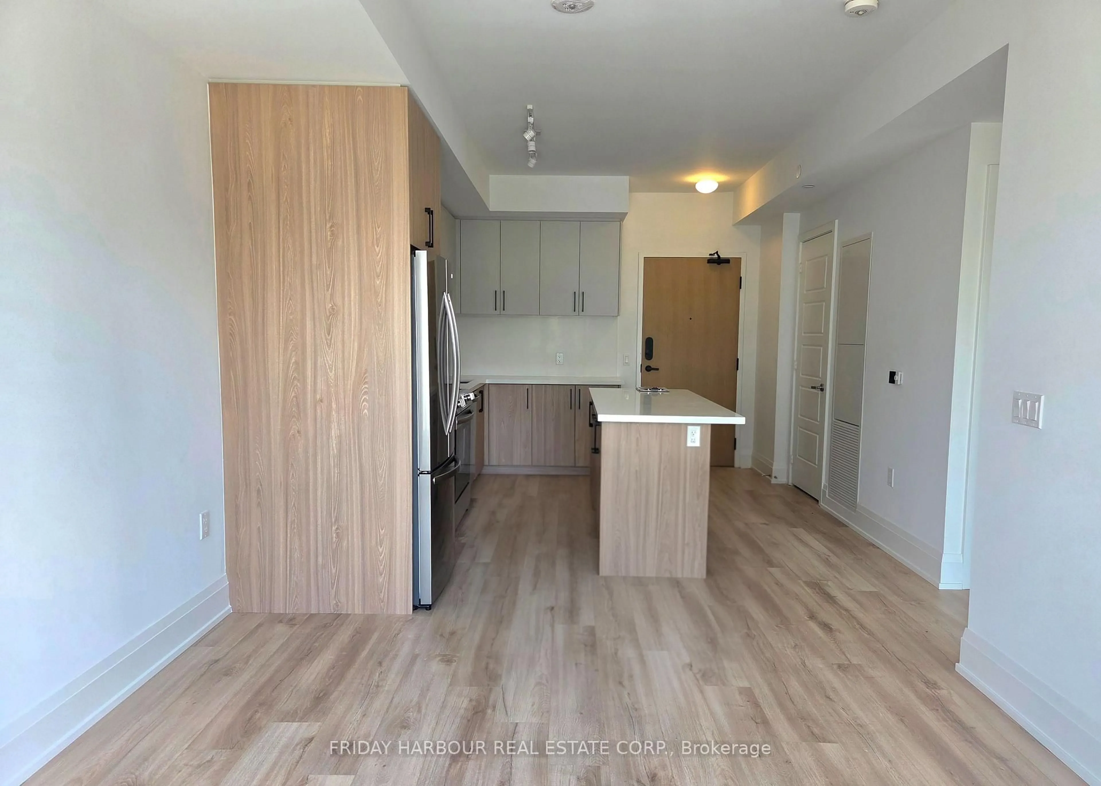 Open concept kitchen, wood/laminate floor for 333 Sunseeker Ave #205, Innisfil Ontario L9S 0J7