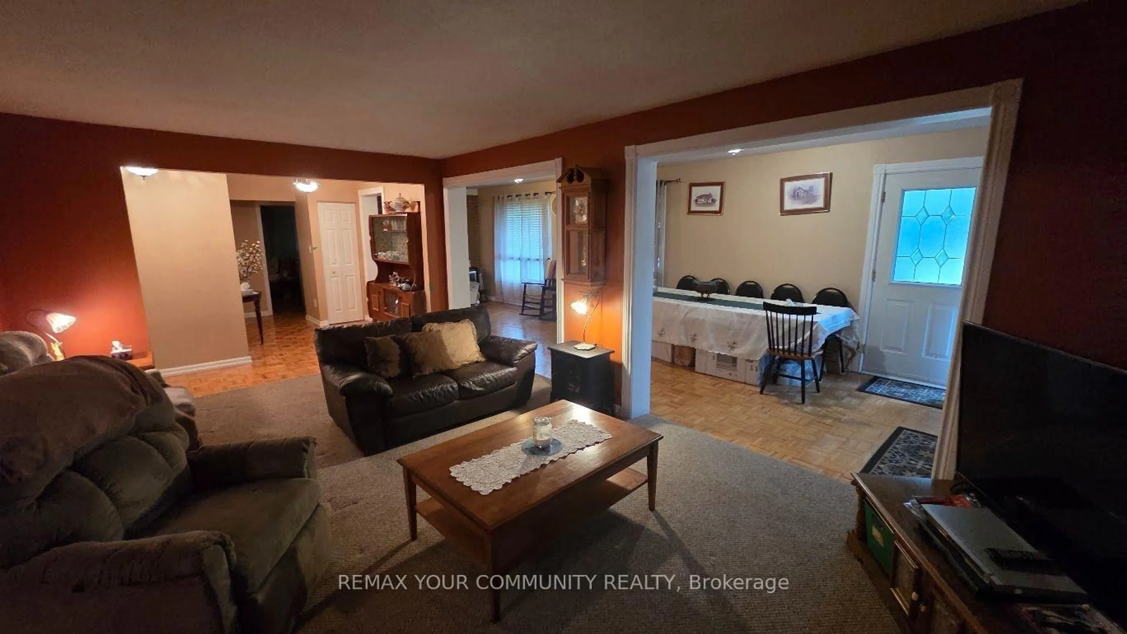 Living room with furniture, wood/laminate floor for 1031 Metro Rd, Georgina Ontario L4P 3E9
