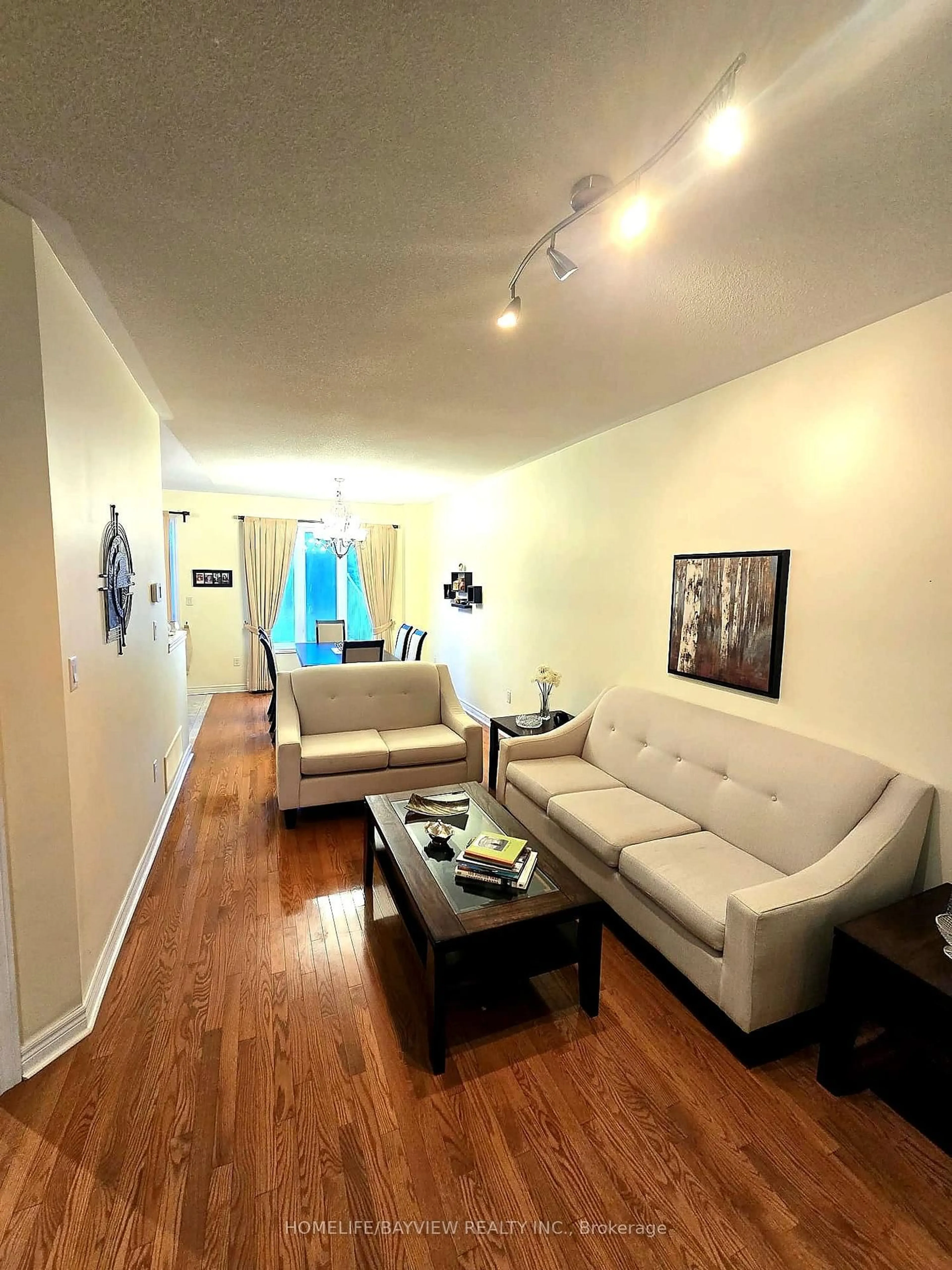 Living room with furniture, wood/laminate floor for 8 Townwood Dr #7, Richmond Hill Ontario L4E 4Y1