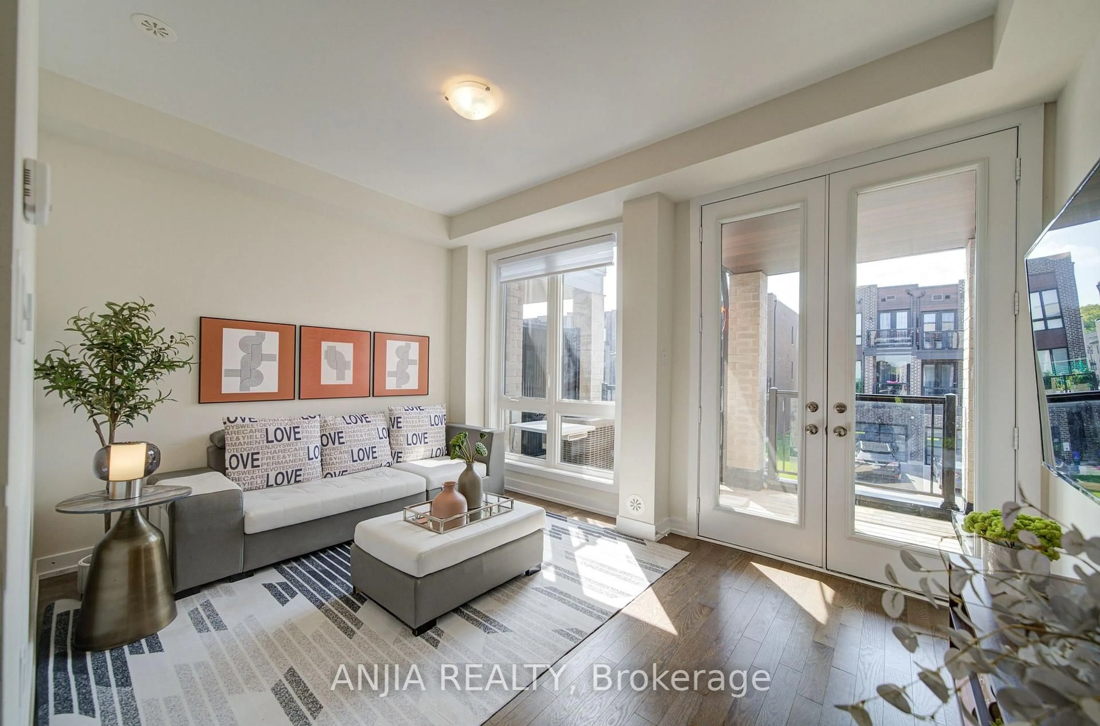 Living room with furniture, wood/laminate floor for 83 Mikayla Lane, Markham Ontario L6B 1R1