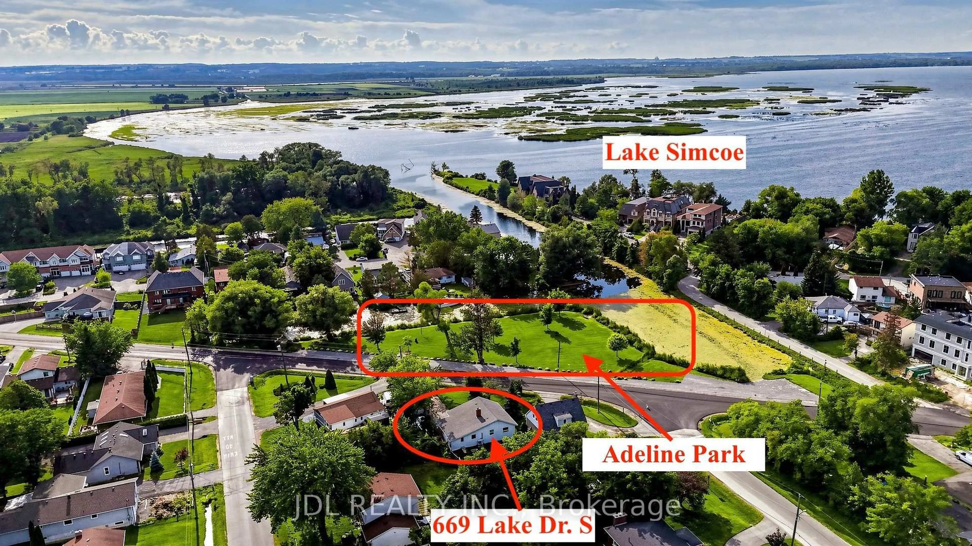 A pic from outside/outdoor area/front of a property/back of a property/a pic from drone, water/lake/river/ocean view for 669 Lake Dr, Georgina Ontario L4P 1T8