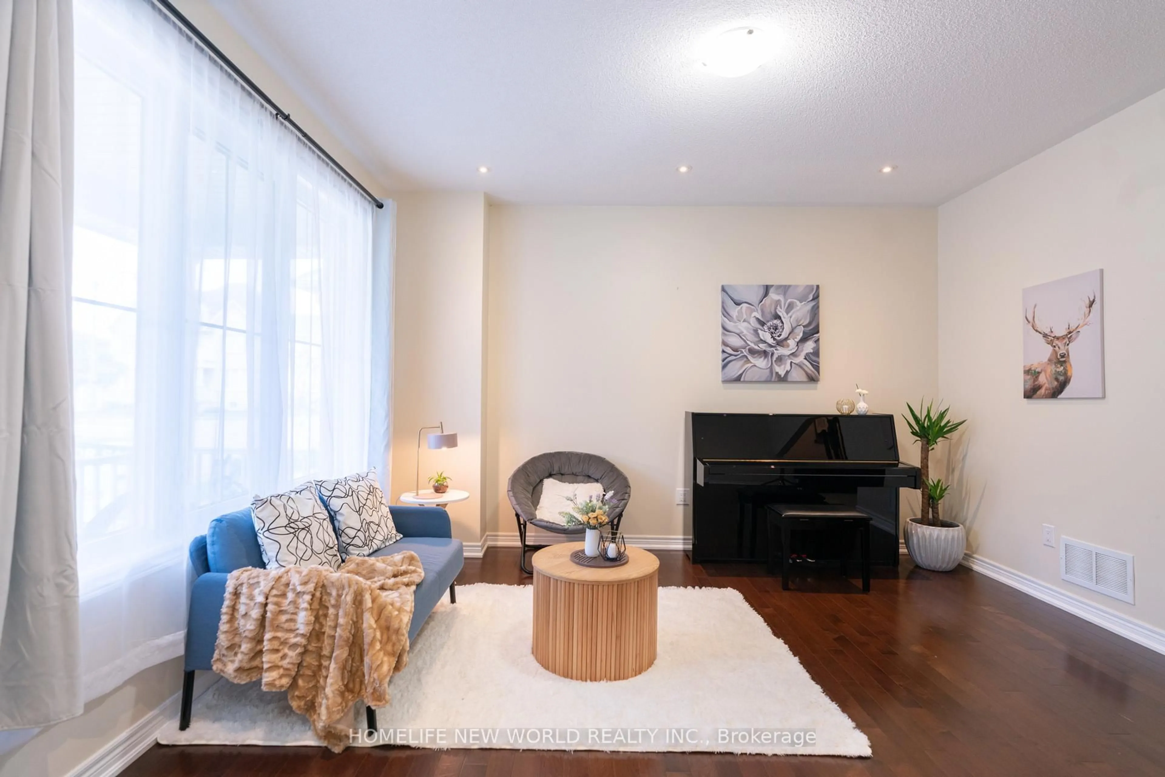 Living room with furniture, wood/laminate floor for 35 Cinemark Ave, Markham Ontario L6B 0W2