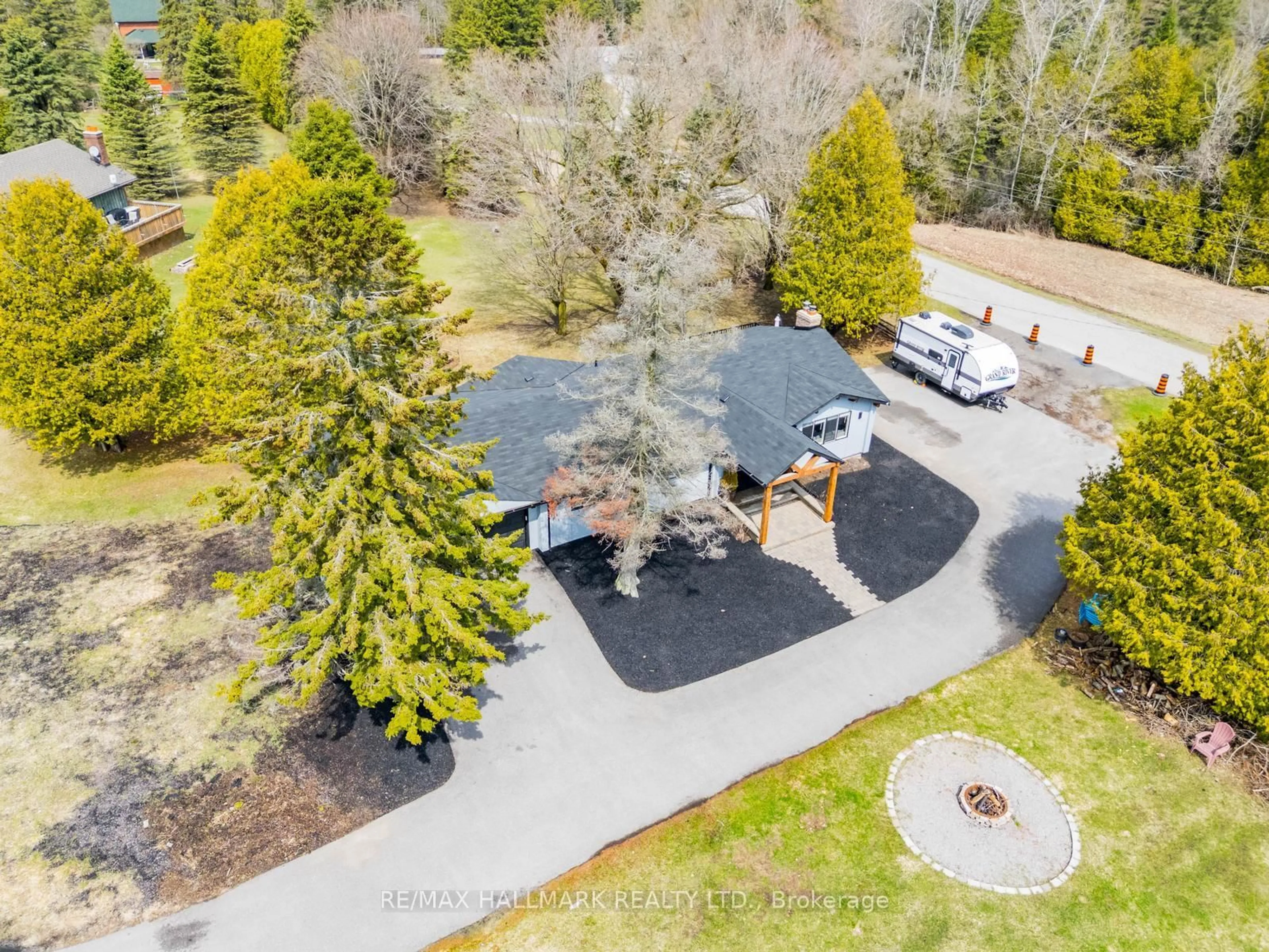 A pic from outside/outdoor area/front of a property/back of a property/a pic from drone, forest/trees view for 5C Mill Run Gate, Uxbridge Ontario L0C 1A0