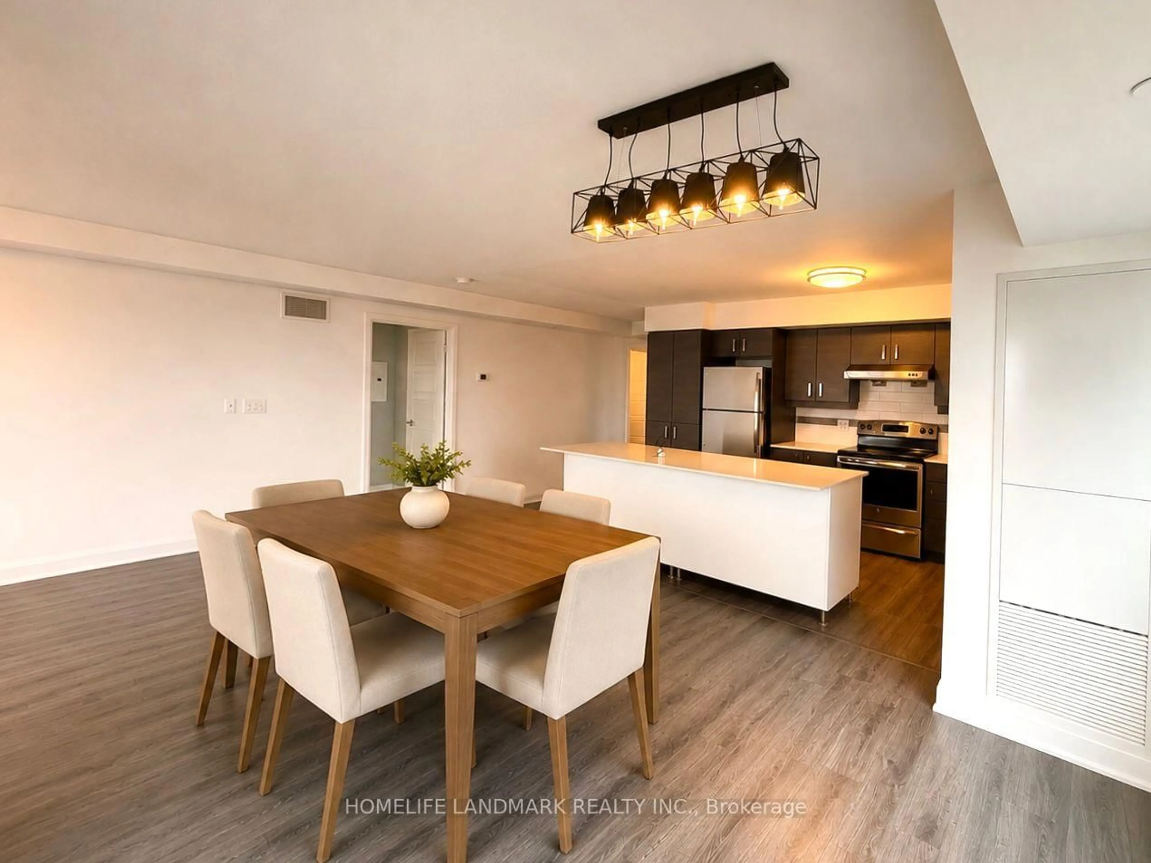 Open concept kitchen, wood/laminate floor for 1 Uptown Dr #1702, Markham Ontario L3R 5C1