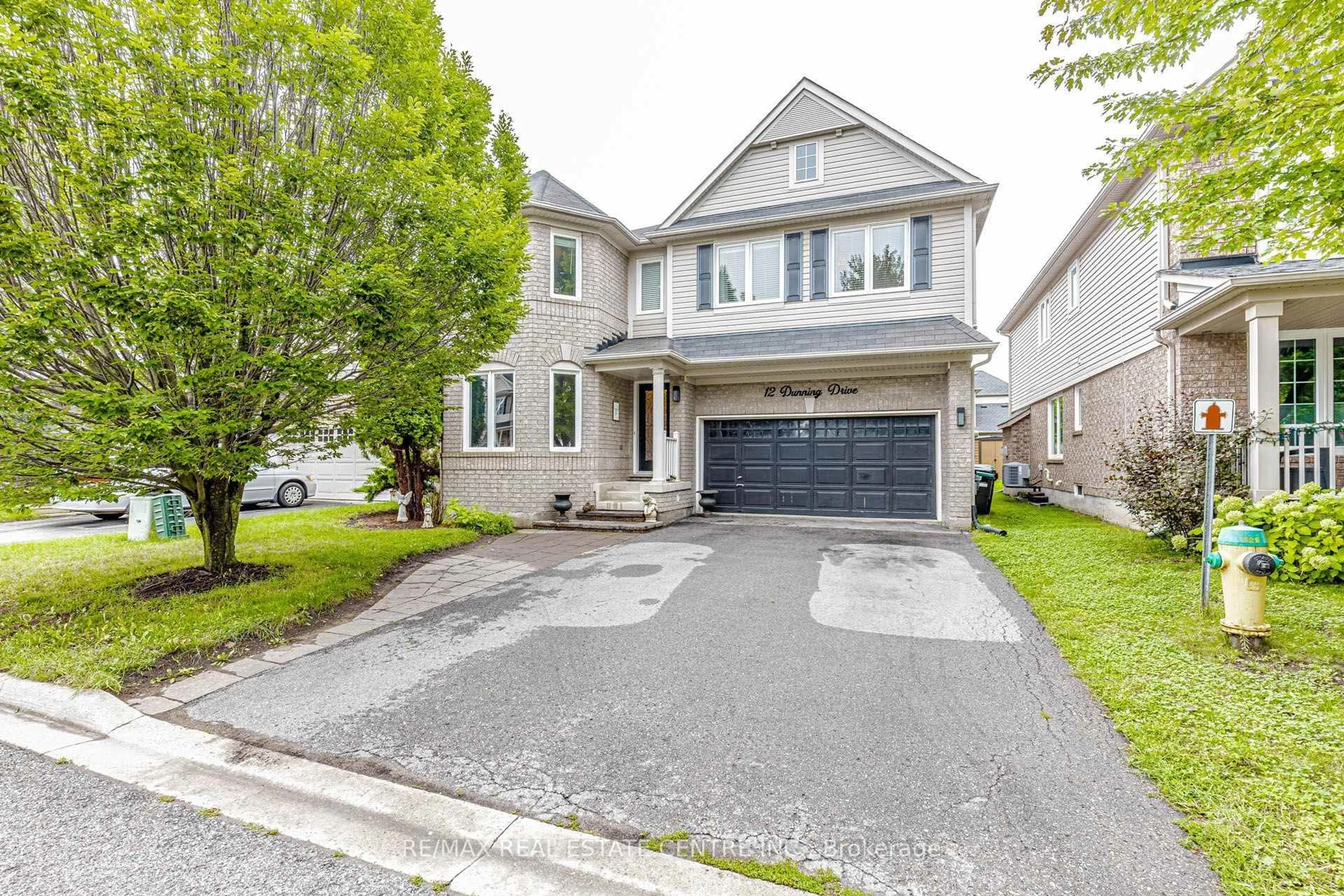 Home with vinyl exterior material, street for 12 Dunning Dr, New Tecumseth Ontario L9R 0B5