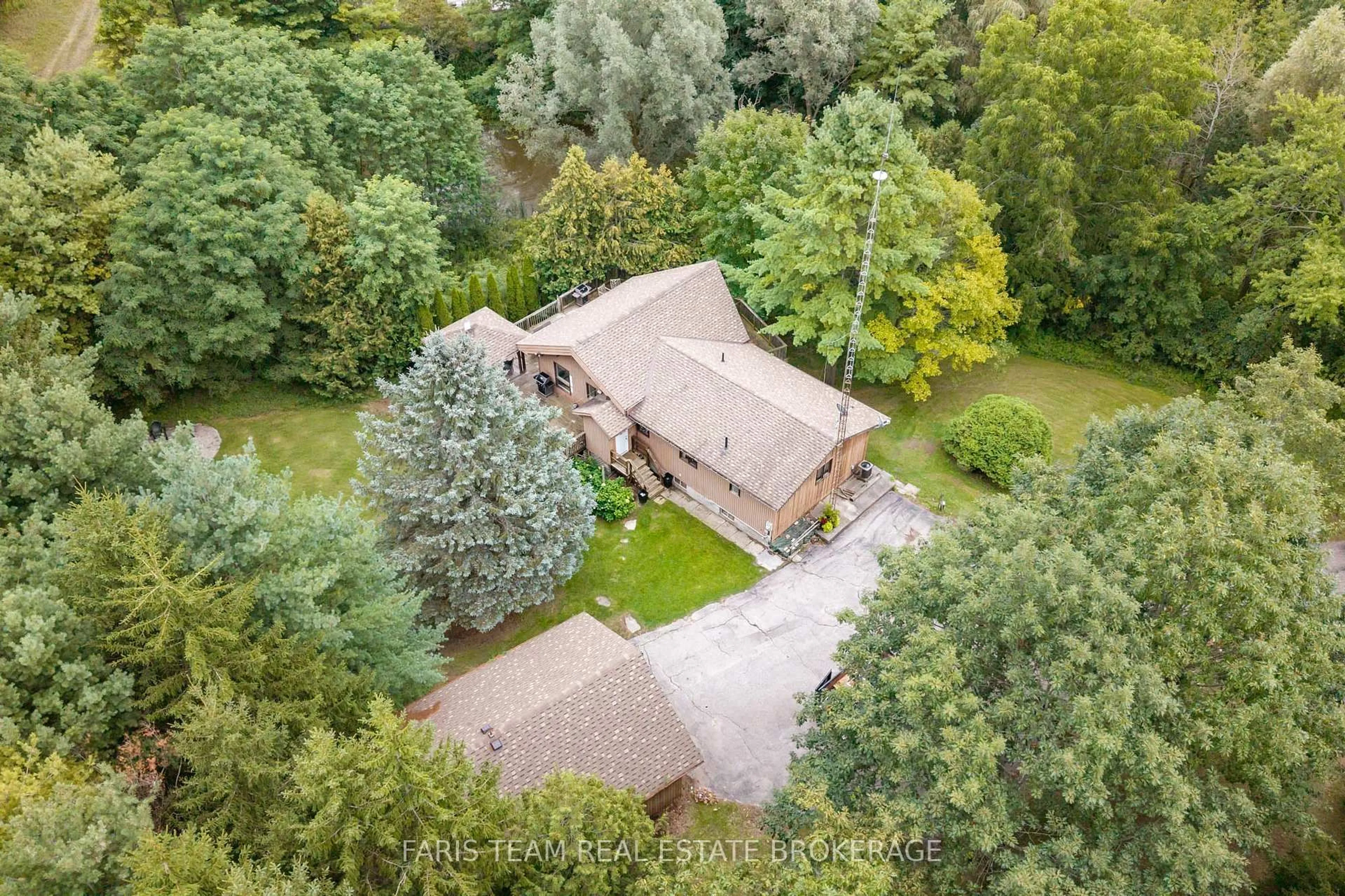 A pic from outside/outdoor area/front of a property/back of a property/a pic from drone, forest/trees view for 1805 County Road 50, New Tecumseth Ontario L0G 1W0